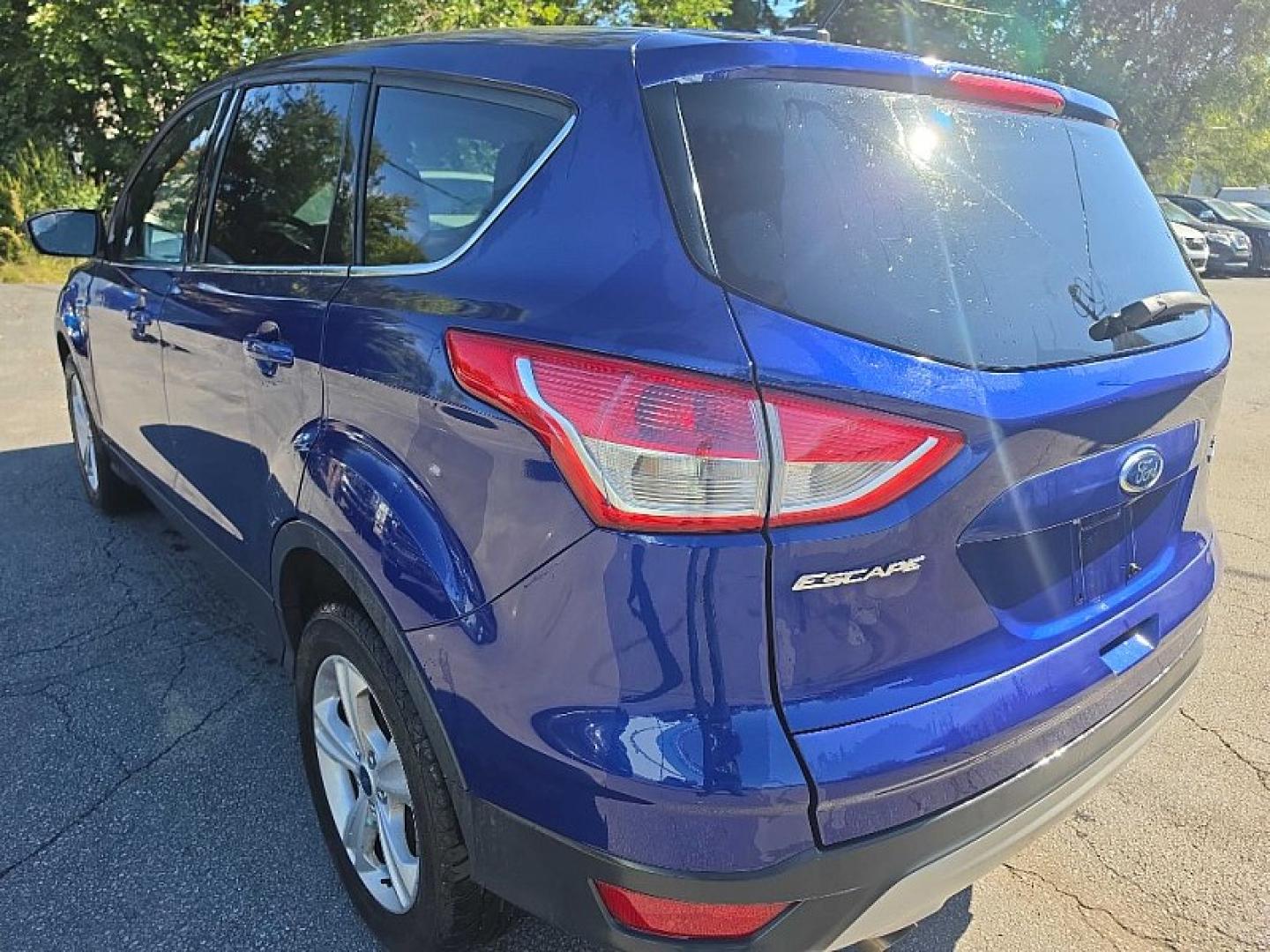 2016 BLUE /BLACK Ford Escape SE 4WD (1FMCU9GX2GU) with an 1.6L L4 DOHC 16V engine, 6A transmission, located at 3304 Woodville Road, Northwood, OH, 43619, (419) 210-8019, 41.612694, -83.480743 - Your #1 Destination for Auto Loans and mdash;No Matter Your Credit!At our dealership, we believe everyone deserves the opportunity to drive their dream car and mdash;whether you have good credit, bad credit, or no credit at all. With a wide selection of hundreds of cars, trucks, and SUVs, you'll fin- Photo#2