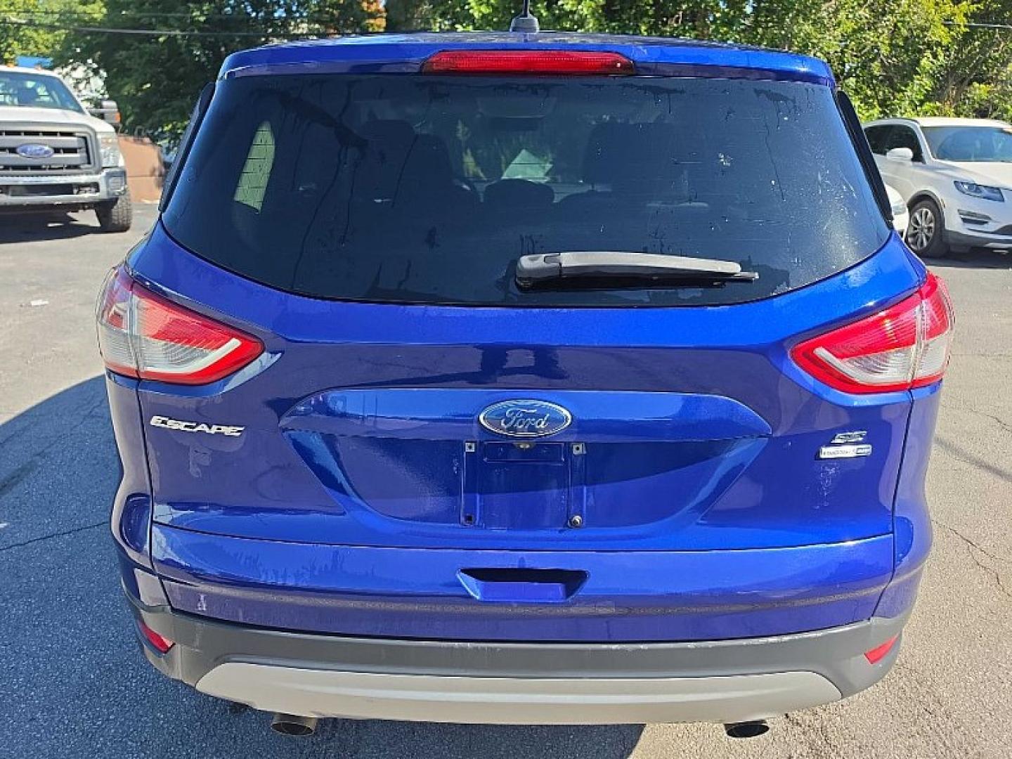 2016 BLUE /BLACK Ford Escape SE 4WD (1FMCU9GX2GU) with an 1.6L L4 DOHC 16V engine, 6A transmission, located at 3304 Woodville Road, Northwood, OH, 43619, (419) 210-8019, 41.612694, -83.480743 - Your #1 Destination for Auto Loans and mdash;No Matter Your Credit!At our dealership, we believe everyone deserves the opportunity to drive their dream car and mdash;whether you have good credit, bad credit, or no credit at all. With a wide selection of hundreds of cars, trucks, and SUVs, you'll fin- Photo#3