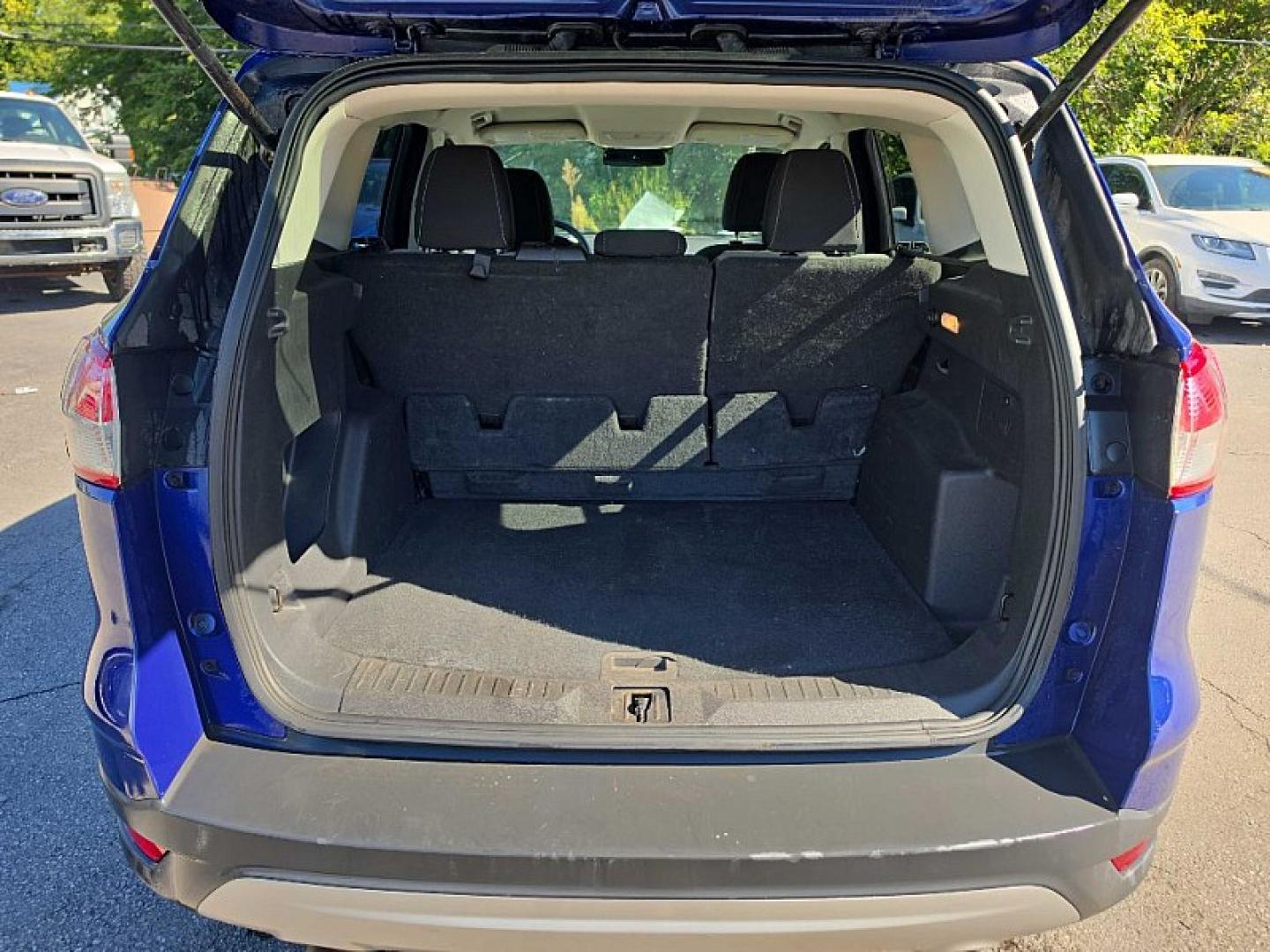 2016 BLUE /BLACK Ford Escape SE 4WD (1FMCU9GX2GU) with an 1.6L L4 DOHC 16V engine, 6A transmission, located at 3304 Woodville Road, Northwood, OH, 43619, (419) 210-8019, 41.612694, -83.480743 - Your #1 Destination for Auto Loans and mdash;No Matter Your Credit!At our dealership, we believe everyone deserves the opportunity to drive their dream car and mdash;whether you have good credit, bad credit, or no credit at all. With a wide selection of hundreds of cars, trucks, and SUVs, you'll fin- Photo#12