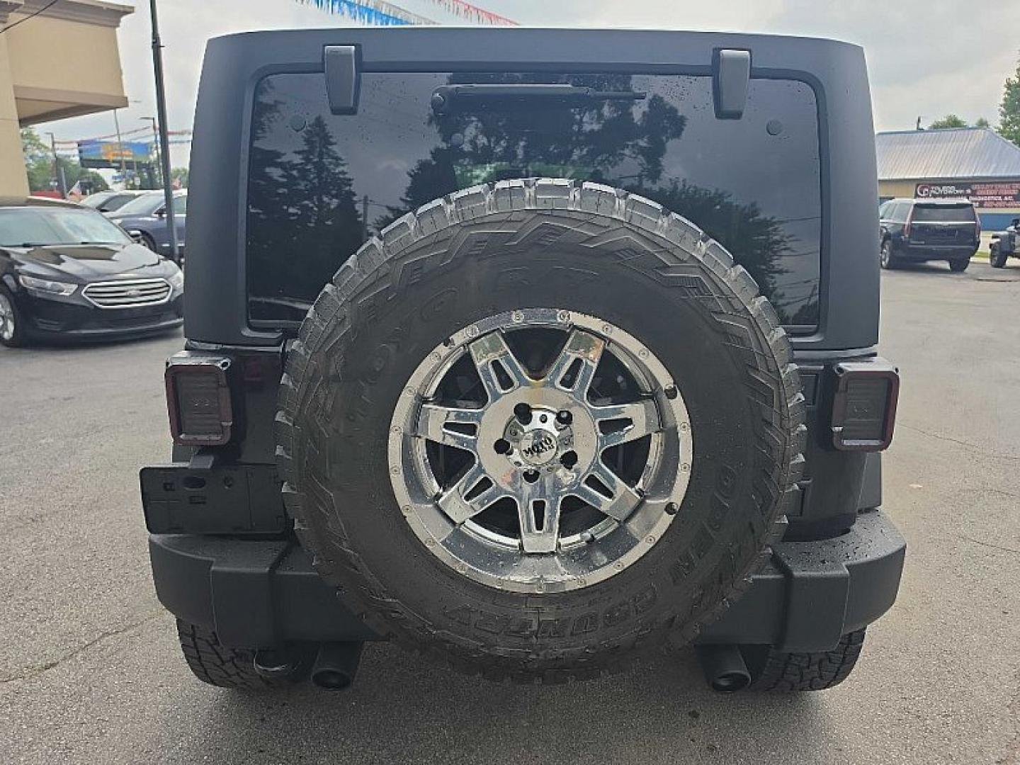 2014 BLACK /BLACK Jeep Wrangler Unlimited Sport 4WD (1C4BJWDG3EL) with an 3.6L V6 DOHC 24V FFV engine, Automatic 5-Spd transmission, located at 3304 Woodville Road, Northwood, OH, 43619, (419) 210-8019, 41.612694, -83.480743 - Your #1 Destination for Auto Loans and mdash;No Matter Your Credit!At our dealership, we believe everyone deserves the opportunity to drive their dream car and mdash;whether you have good credit, bad credit, or no credit at all. With a wide selection of hundreds of cars, trucks, and SUVs, you'll fin- Photo#3