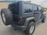 2014 BLACK /BLACK Jeep Wrangler Unlimited Sport 4WD (1C4BJWDG3EL) with an 3.6L V6 DOHC 24V FFV engine, Automatic 5-Spd transmission, located at 3304 Woodville Road, Northwood, OH, 43619, (419) 210-8019, 41.612694, -83.480743 - Your #1 Destination for Auto Loans and mdash;No Matter Your Credit!At our dealership, we believe everyone deserves the opportunity to drive their dream car and mdash;whether you have good credit, bad credit, or no credit at all. With a wide selection of hundreds of cars, trucks, and SUVs, you'll fin- Photo#4