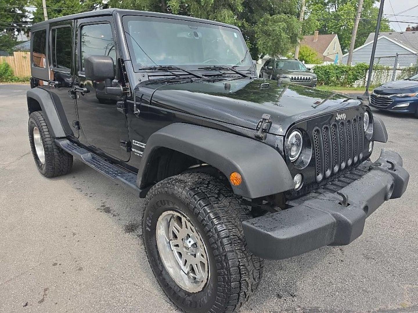 2014 BLACK /BLACK Jeep Wrangler Unlimited Sport 4WD (1C4BJWDG3EL) with an 3.6L V6 DOHC 24V FFV engine, Automatic 5-Spd transmission, located at 3304 Woodville Road, Northwood, OH, 43619, (419) 210-8019, 41.612694, -83.480743 - Your #1 Destination for Auto Loans and mdash;No Matter Your Credit!At our dealership, we believe everyone deserves the opportunity to drive their dream car and mdash;whether you have good credit, bad credit, or no credit at all. With a wide selection of hundreds of cars, trucks, and SUVs, you'll fin- Photo#6