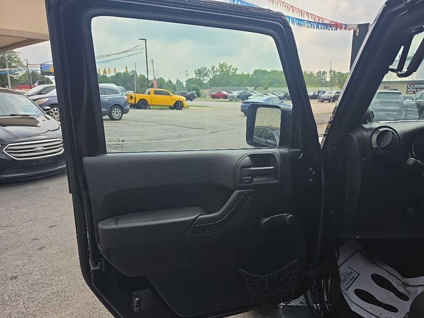 2014 BLACK /BLACK Jeep Wrangler Unlimited Sport 4WD (1C4BJWDG3EL) with an 3.6L V6 DOHC 24V FFV engine, Automatic 5-Spd transmission, located at 3304 Woodville Road, Northwood, OH, 43619, (419) 210-8019, 41.612694, -83.480743 - Your #1 Destination for Auto Loans and mdash;No Matter Your Credit!At our dealership, we believe everyone deserves the opportunity to drive their dream car and mdash;whether you have good credit, bad credit, or no credit at all. With a wide selection of hundreds of cars, trucks, and SUVs, you'll fin- Photo#8