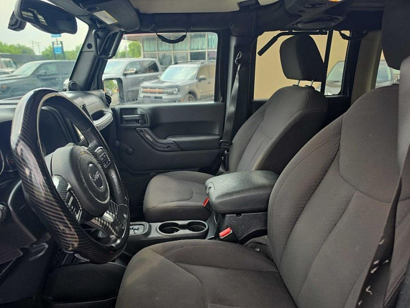 2014 BLACK /BLACK Jeep Wrangler Unlimited Sport 4WD (1C4BJWDG3EL) with an 3.6L V6 DOHC 24V FFV engine, Automatic 5-Spd transmission, located at 3304 Woodville Road, Northwood, OH, 43619, (419) 210-8019, 41.612694, -83.480743 - Your #1 Destination for Auto Loans and mdash;No Matter Your Credit!At our dealership, we believe everyone deserves the opportunity to drive their dream car and mdash;whether you have good credit, bad credit, or no credit at all. With a wide selection of hundreds of cars, trucks, and SUVs, you'll fin- Photo#9