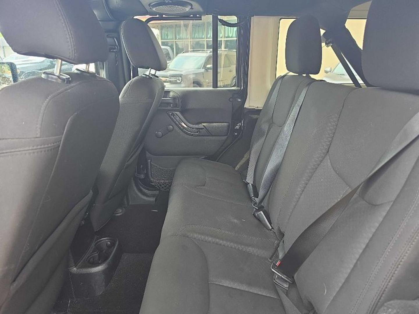 2014 BLACK /BLACK Jeep Wrangler Unlimited Sport 4WD (1C4BJWDG3EL) with an 3.6L V6 DOHC 24V FFV engine, Automatic 5-Spd transmission, located at 3304 Woodville Road, Northwood, OH, 43619, (419) 210-8019, 41.612694, -83.480743 - Your #1 Destination for Auto Loans and mdash;No Matter Your Credit!At our dealership, we believe everyone deserves the opportunity to drive their dream car and mdash;whether you have good credit, bad credit, or no credit at all. With a wide selection of hundreds of cars, trucks, and SUVs, you'll fin- Photo#11