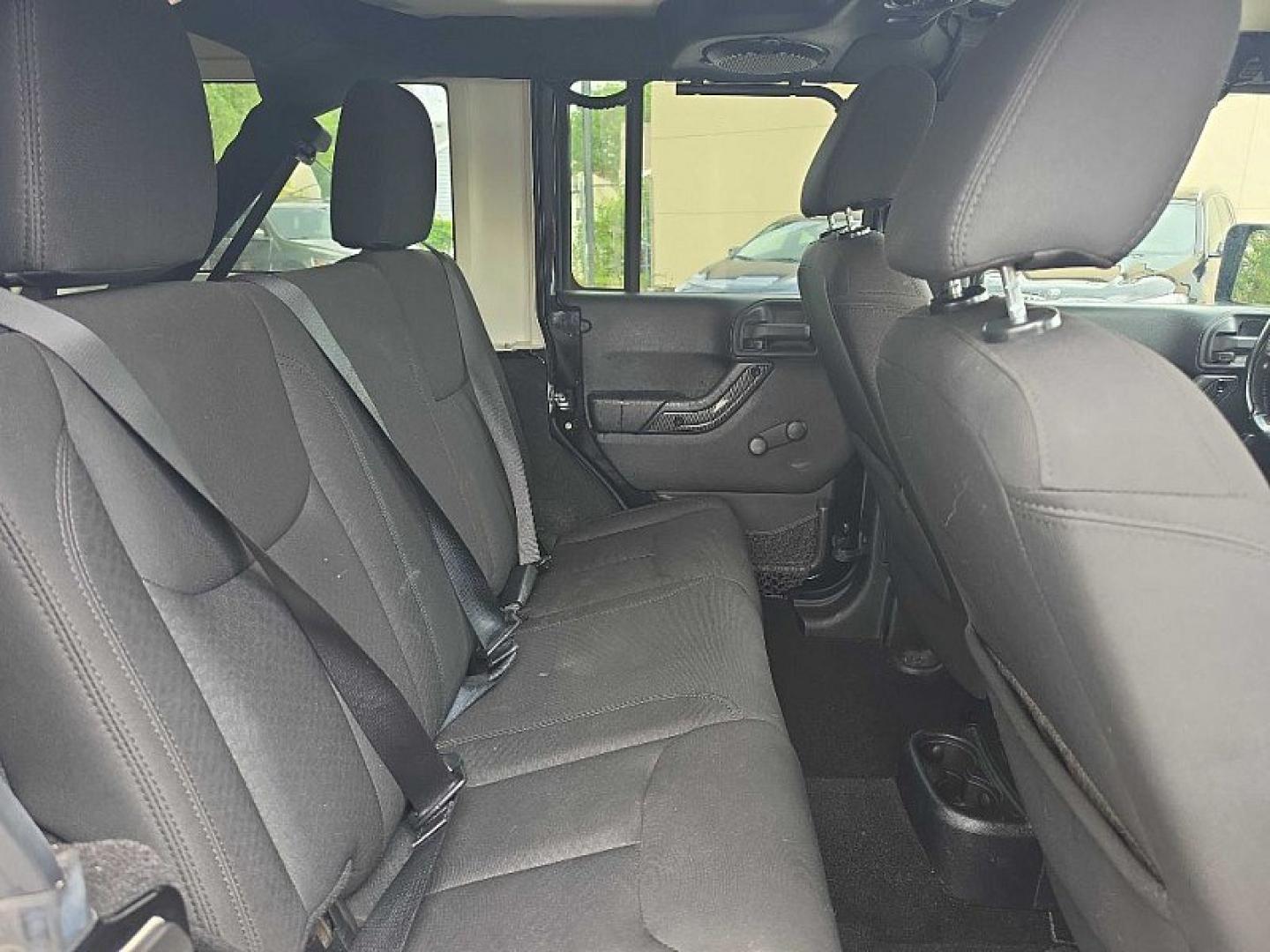 2014 BLACK /BLACK Jeep Wrangler Unlimited Sport 4WD (1C4BJWDG3EL) with an 3.6L V6 DOHC 24V FFV engine, Automatic 5-Spd transmission, located at 3304 Woodville Road, Northwood, OH, 43619, (419) 210-8019, 41.612694, -83.480743 - Your #1 Destination for Auto Loans and mdash;No Matter Your Credit!At our dealership, we believe everyone deserves the opportunity to drive their dream car and mdash;whether you have good credit, bad credit, or no credit at all. With a wide selection of hundreds of cars, trucks, and SUVs, you'll fin- Photo#15