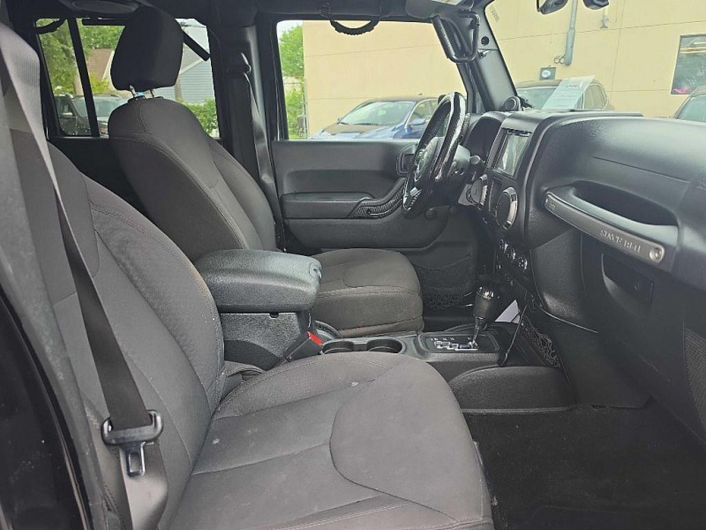 2014 BLACK /BLACK Jeep Wrangler Unlimited Sport 4WD (1C4BJWDG3EL) with an 3.6L V6 DOHC 24V FFV engine, Automatic 5-Spd transmission, located at 3304 Woodville Road, Northwood, OH, 43619, (419) 210-8019, 41.612694, -83.480743 - Your #1 Destination for Auto Loans and mdash;No Matter Your Credit!At our dealership, we believe everyone deserves the opportunity to drive their dream car and mdash;whether you have good credit, bad credit, or no credit at all. With a wide selection of hundreds of cars, trucks, and SUVs, you'll fin- Photo#17