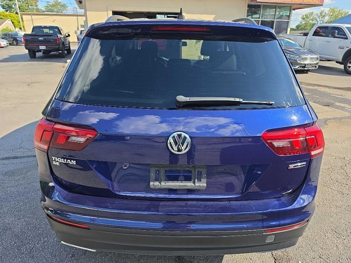 2021 BLUE /PUSHB Volkswagen Tiguan SE 4Motion AWD (3VV2B7AX0MM) with an 2.0L L4 DOHC 16V TURBO engine, 8A transmission, located at 3304 Woodville Road, Northwood, OH, 43619, (419) 210-8019, 41.612694, -83.480743 - Your #1 Destination for Auto Loans and mdash;No Matter Your Credit!At our dealership, we believe everyone deserves the opportunity to drive their dream car and mdash;whether you have good credit, bad credit, or no credit at all. With a wide selection of hundreds of cars, trucks, and SUVs, you'll fin- Photo#3
