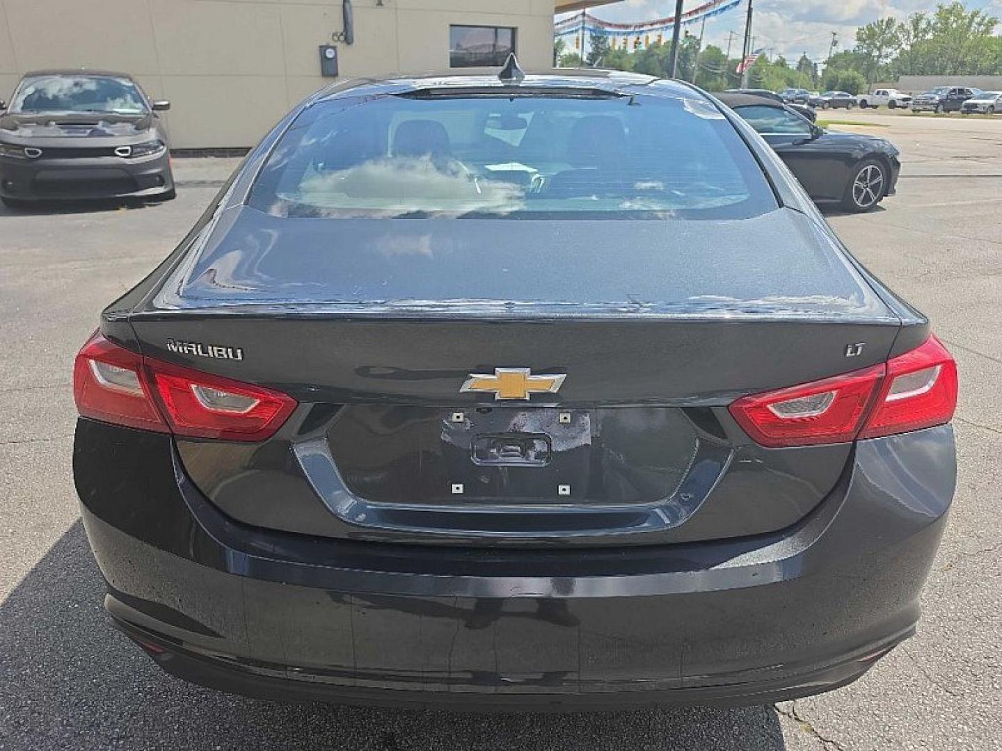 2017 GRAY Chevrolet Malibu 1LT (1G1ZE5STXHF) with an 1.5L L4 DOHC 16V engine, 6A transmission, located at 3304 Woodville Road, Northwood, OH, 43619, (419) 210-8019, 41.612694, -83.480743 - Your #1 Destination for Auto Loans and mdash;No Matter Your Credit!At our dealership, we believe everyone deserves the opportunity to drive their dream car and mdash;whether you have good credit, bad credit, or no credit at all. With a wide selection of hundreds of cars, trucks, and SUVs, you'll fin- Photo#3