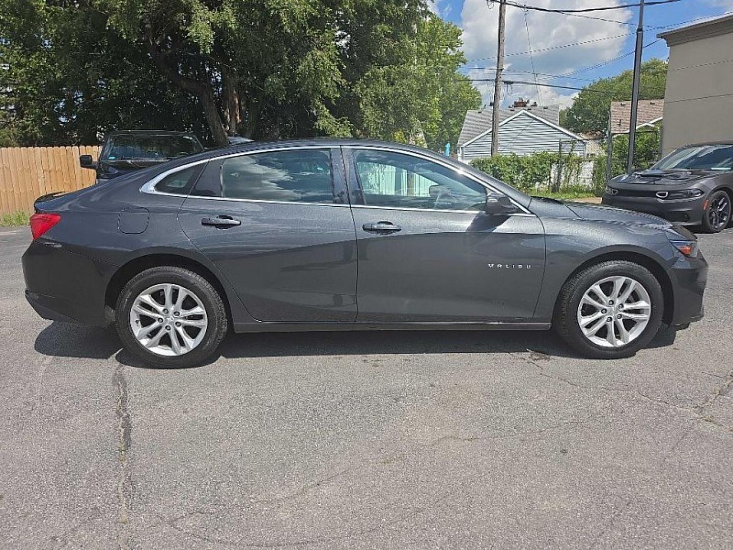2017 GRAY Chevrolet Malibu 1LT (1G1ZE5STXHF) with an 1.5L L4 DOHC 16V engine, 6A transmission, located at 3304 Woodville Road, Northwood, OH, 43619, (419) 210-8019, 41.612694, -83.480743 - Your #1 Destination for Auto Loans and mdash;No Matter Your Credit!At our dealership, we believe everyone deserves the opportunity to drive their dream car and mdash;whether you have good credit, bad credit, or no credit at all. With a wide selection of hundreds of cars, trucks, and SUVs, you'll fin- Photo#5