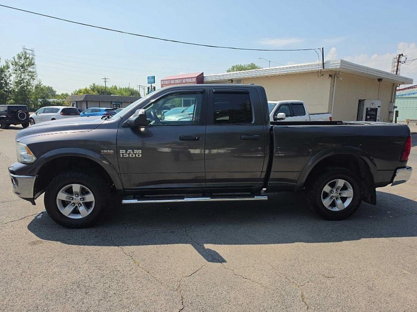 2017 GRAY /GRAY RAM 1500 SLT Quad Cab 4WD (1C6RR7GT7HS) with an 5.7L V8 OHV 16V engine, 8A transmission, located at 3304 Woodville Road, Northwood, OH, 43619, (419) 210-8019, 41.612694, -83.480743- Photo#4
