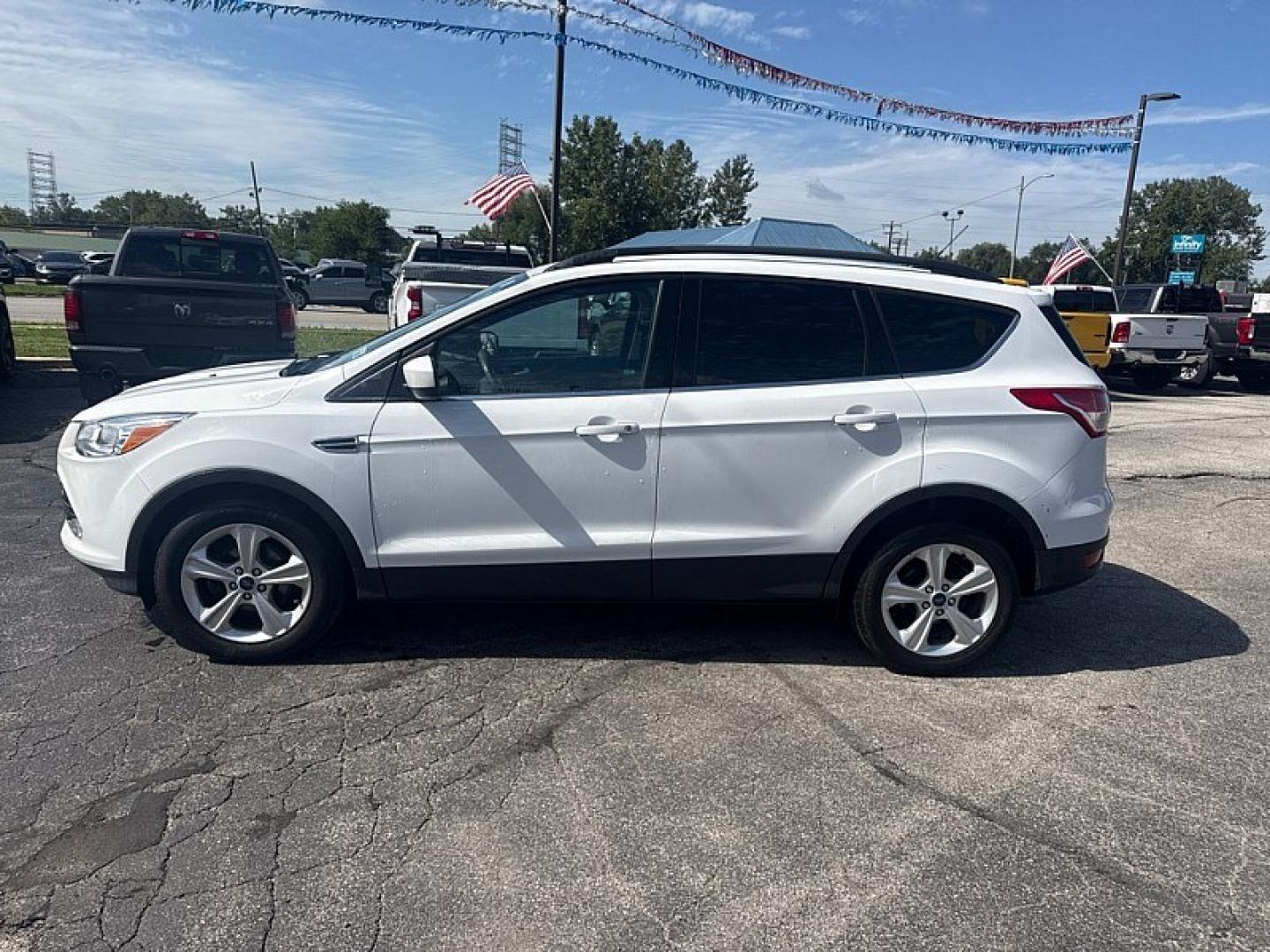 2016 WHITE /TAN Ford Escape SE FWD (1FMCU0GX8GU) with an 1.6L L4 DOHC 16V engine, 6A transmission, located at 3304 Woodville Road, Northwood, OH, 43619, (419) 210-8019, 41.612694, -83.480743 - Your #1 Destination for Auto Loans and mdash;No Matter Your Credit!At our dealership, we believe everyone deserves the opportunity to drive their dream car and mdash;whether you have good credit, bad credit, or no credit at all. With a wide selection of hundreds of cars, trucks, and SUVs, you'll fin- Photo#1