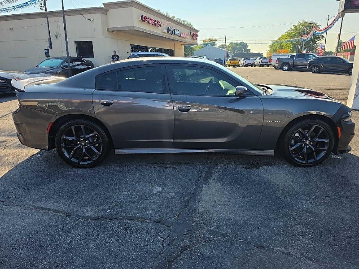 2021 GRAY /BLACK Dodge Charger R/T (2C3CDXCT9MH) with an 5.7L V8 OHV 16V engine, 8A transmission, located at 3304 Woodville Road, Northwood, OH, 43619, (419) 210-8019, 41.612694, -83.480743 - Your #1 Destination for Auto Loans and mdash;No Matter Your Credit!At our dealership, we believe everyone deserves the opportunity to drive their dream car and mdash;whether you have good credit, bad credit, or no credit at all. With a wide selection of hundreds of cars, trucks, and SUVs, you'll fin- Photo#5