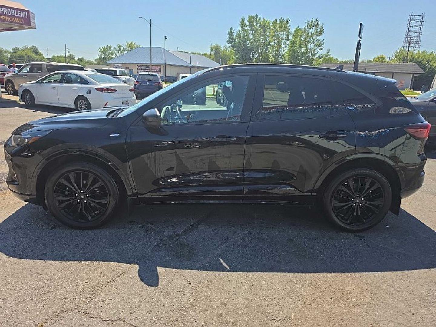 2023 BLACK /BLACK Ford Escape ST-Line Elite Hybrid AWD (1FMCU9PZ1PU) with an 2.5L L4 DOHC 16V HYBRID engine, 8A transmission, located at 3304 Woodville Road, Northwood, OH, 43619, (419) 210-8019, 41.612694, -83.480743 - Your #1 Destination for Auto Loans and mdash;No Matter Your Credit!At our dealership, we believe everyone deserves the opportunity to drive their dream car and mdash;whether you have good credit, bad credit, or no credit at all. With a wide selection of hundreds of cars, trucks, and SUVs, you'll fin- Photo#1