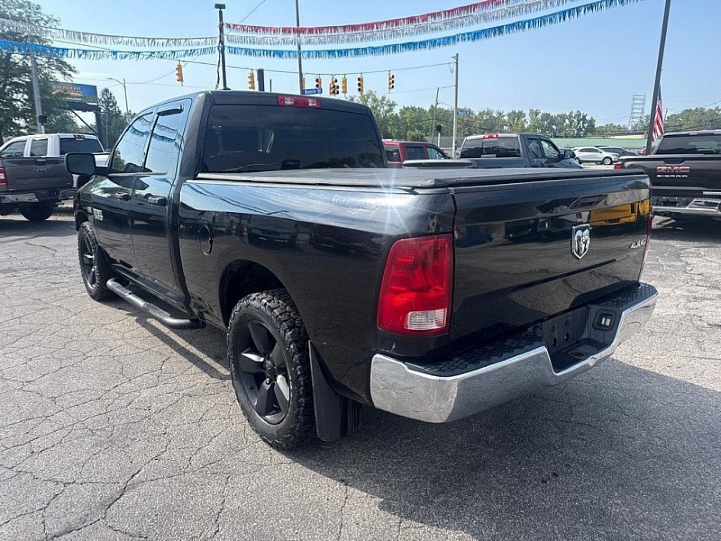 2017 BLACK /BLACK RAM 1500 Tradesman Quad Cab 4WD (1C6RR7FTXHS) with an 5.7L V8 OHV 16V engine, 8A transmission, located at 3304 Woodville Road, Northwood, OH, 43619, (419) 210-8019, 41.612694, -83.480743 - Your #1 Destination for Auto Loans and mdash;No Matter Your Credit!At our dealership, we believe everyone deserves the opportunity to drive their dream car and mdash;whether you have good credit, bad credit, or no credit at all. With a wide selection of hundreds of cars, trucks, and SUVs, you'll fin- Photo#2