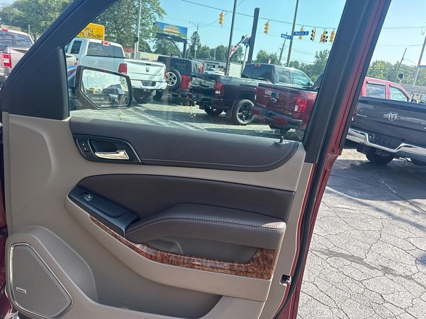 2020 RED /BEIGE Chevrolet Tahoe Premier 4WD (1GNSKCKC6LR) with an 5.3L V8 OHV 16V engine, 6A transmission, located at 3304 Woodville Road, Northwood, OH, 43619, (419) 210-8019, 41.612694, -83.480743 - Your #1 Destination for Auto Loans and mdash;No Matter Your Credit!At our dealership, we believe everyone deserves the opportunity to drive their dream car and mdash;whether you have good credit, bad credit, or no credit at all. With a wide selection of hundreds of cars, trucks, and SUVs, you'll fin- Photo#13