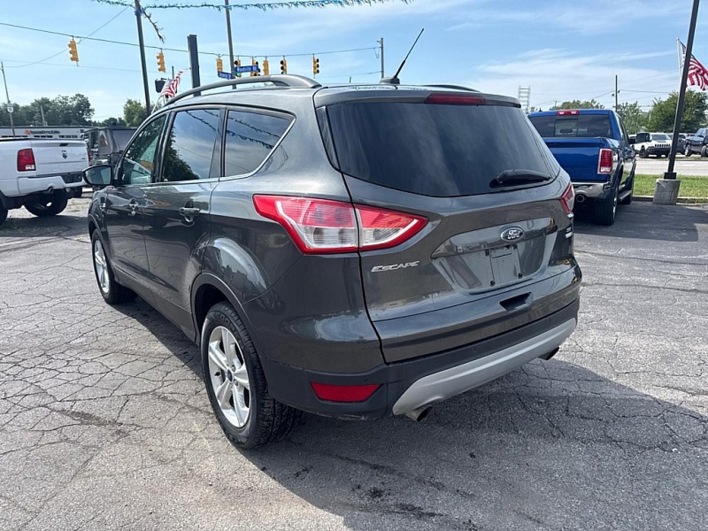 2016 GRAY /BLACK Ford Escape SE 4WD (1FMCU9GX9GU) with an 1.6L L4 DOHC 16V engine, 6A transmission, located at 3304 Woodville Road, Northwood, OH, 43619, (419) 210-8019, 41.612694, -83.480743 - Your #1 Destination for Auto Loans and mdash;No Matter Your Credit!At our dealership, we believe everyone deserves the opportunity to drive their dream car and mdash;whether you have good credit, bad credit, or no credit at all. With a wide selection of hundreds of cars, trucks, and SUVs, you'll fin- Photo#2