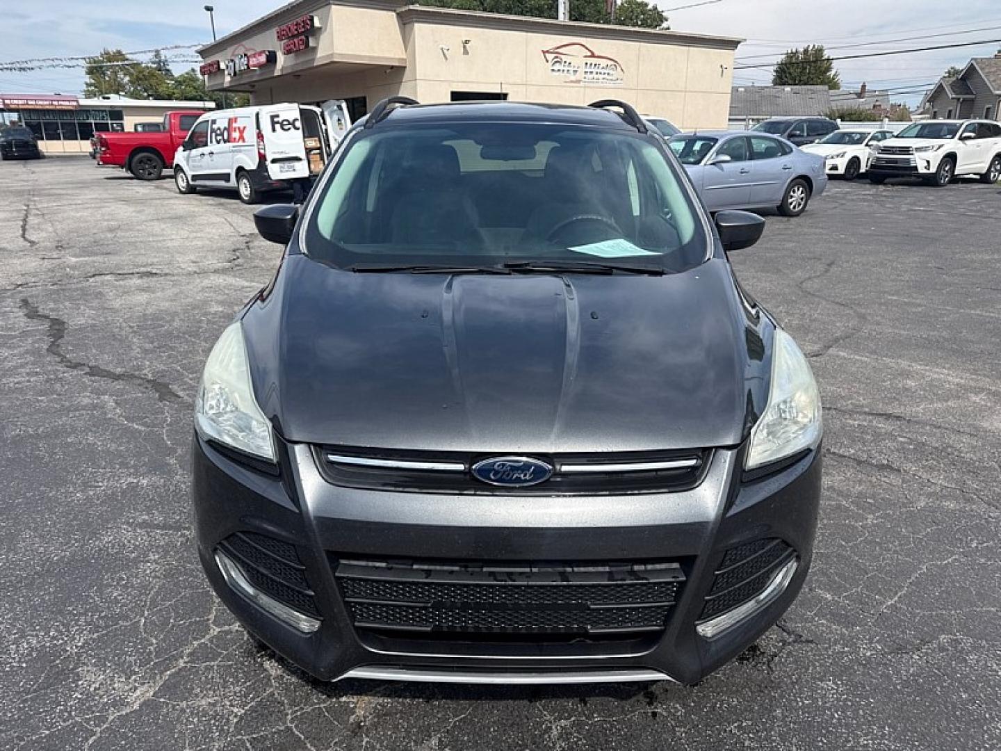 2016 GRAY /BLACK Ford Escape SE 4WD (1FMCU9GX9GU) with an 1.6L L4 DOHC 16V engine, 6A transmission, located at 3304 Woodville Road, Northwood, OH, 43619, (419) 210-8019, 41.612694, -83.480743 - Your #1 Destination for Auto Loans and mdash;No Matter Your Credit!At our dealership, we believe everyone deserves the opportunity to drive their dream car and mdash;whether you have good credit, bad credit, or no credit at all. With a wide selection of hundreds of cars, trucks, and SUVs, you'll fin- Photo#7
