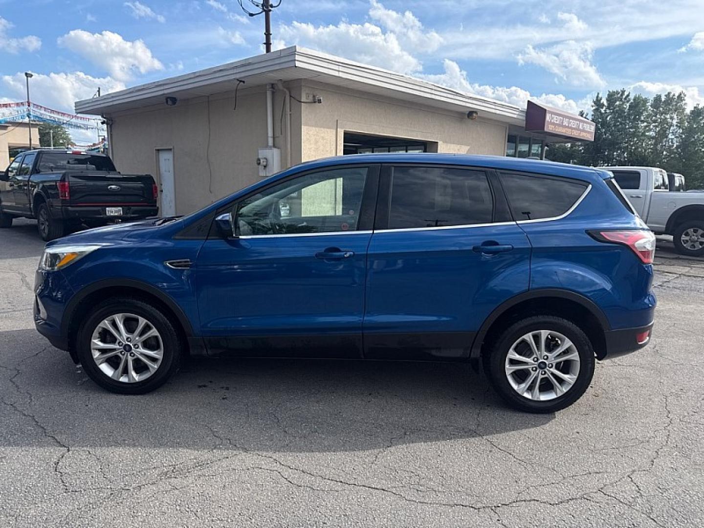 2017 BLUE /BLACK Ford Escape SE 4WD (1FMCU9GD0HU) with an 1.5L L4 DOHC 16V engine, 6A transmission, located at 3304 Woodville Road, Northwood, OH, 43619, (419) 210-8019, 41.612694, -83.480743 - Your #1 Destination for Auto Loans and mdash;No Matter Your Credit!At our dealership, we believe everyone deserves the opportunity to drive their dream car and mdash;whether you have good credit, bad credit, or no credit at all. With a wide selection of hundreds of cars, trucks, and SUVs, you'll fin- Photo#1