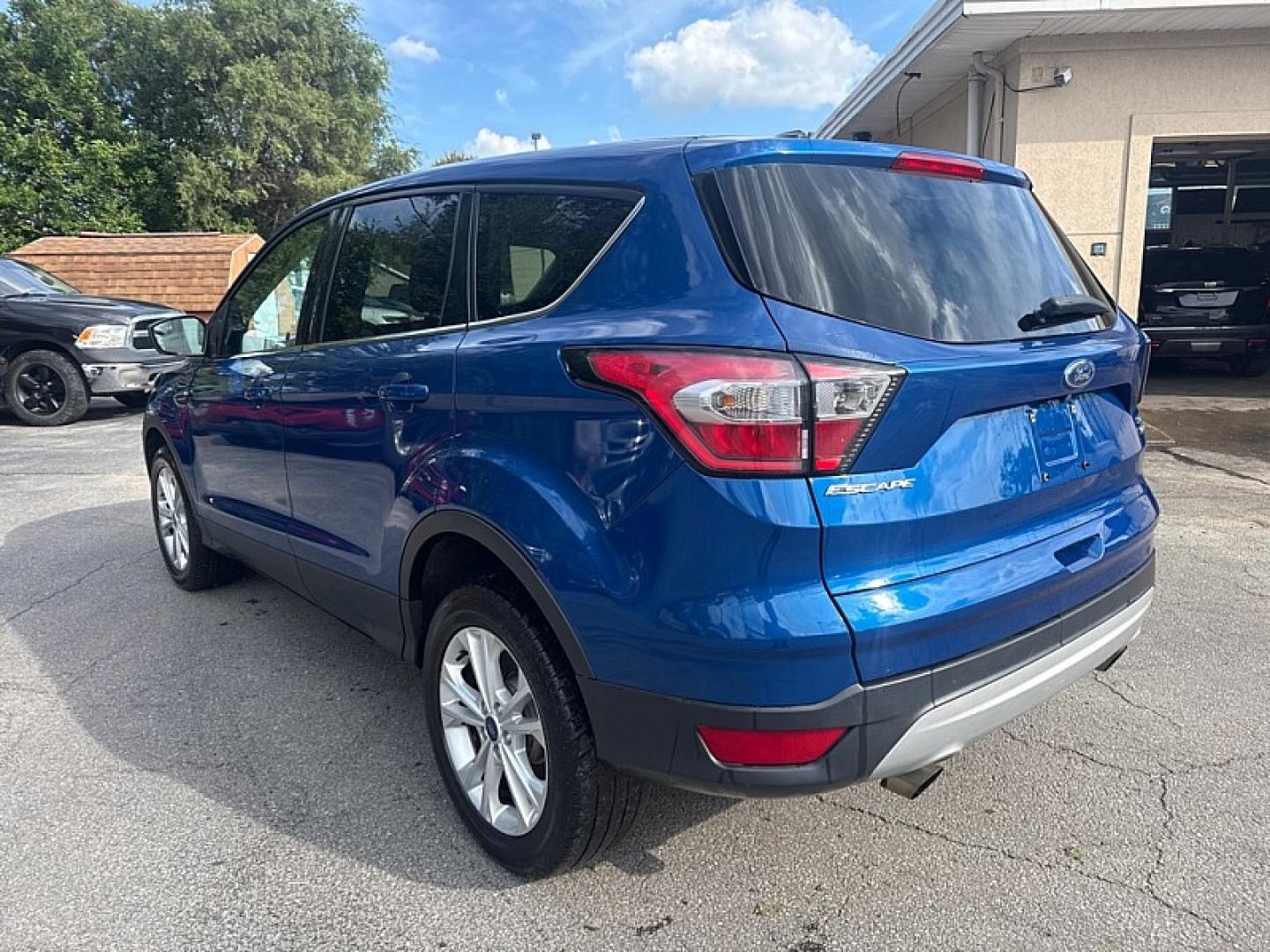 2017 BLUE /BLACK Ford Escape SE 4WD (1FMCU9GD0HU) with an 1.5L L4 DOHC 16V engine, 6A transmission, located at 3304 Woodville Road, Northwood, OH, 43619, (419) 210-8019, 41.612694, -83.480743 - Your #1 Destination for Auto Loans and mdash;No Matter Your Credit!At our dealership, we believe everyone deserves the opportunity to drive their dream car and mdash;whether you have good credit, bad credit, or no credit at all. With a wide selection of hundreds of cars, trucks, and SUVs, you'll fin- Photo#2