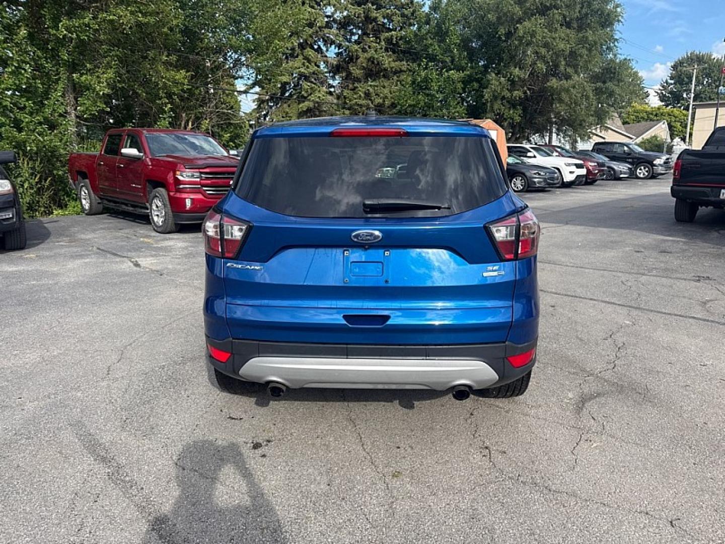 2017 BLUE /BLACK Ford Escape SE 4WD (1FMCU9GD0HU) with an 1.5L L4 DOHC 16V engine, 6A transmission, located at 3304 Woodville Road, Northwood, OH, 43619, (419) 210-8019, 41.612694, -83.480743 - Your #1 Destination for Auto Loans and mdash;No Matter Your Credit!At our dealership, we believe everyone deserves the opportunity to drive their dream car and mdash;whether you have good credit, bad credit, or no credit at all. With a wide selection of hundreds of cars, trucks, and SUVs, you'll fin- Photo#3