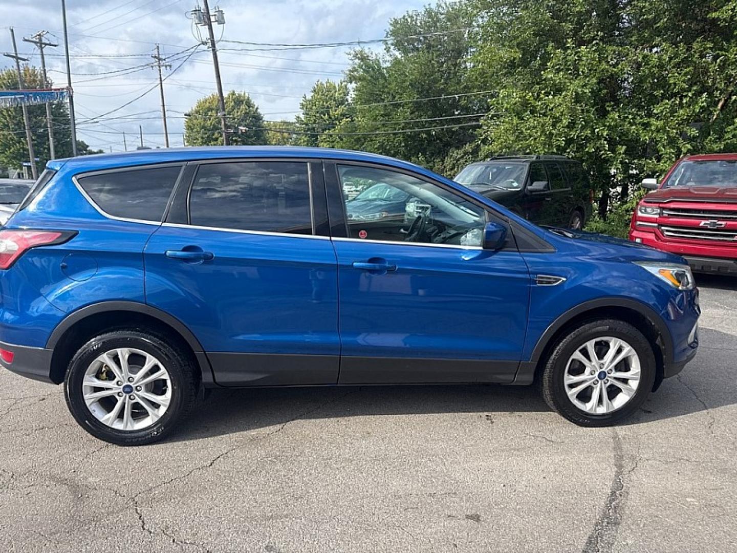 2017 BLUE /BLACK Ford Escape SE 4WD (1FMCU9GD0HU) with an 1.5L L4 DOHC 16V engine, 6A transmission, located at 3304 Woodville Road, Northwood, OH, 43619, (419) 210-8019, 41.612694, -83.480743 - Your #1 Destination for Auto Loans and mdash;No Matter Your Credit!At our dealership, we believe everyone deserves the opportunity to drive their dream car and mdash;whether you have good credit, bad credit, or no credit at all. With a wide selection of hundreds of cars, trucks, and SUVs, you'll fin- Photo#5