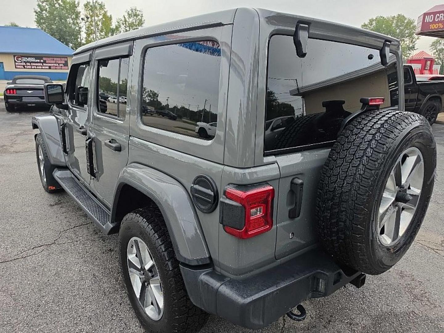 2019 GRAY /BLACK Jeep Wrangler Unlimited Sahara (1C4HJXEG2KW) with an 3.6L V6 DOHC 24V FFV engine, 6A transmission, located at 3304 Woodville Road, Northwood, OH, 43619, (419) 210-8019, 41.612694, -83.480743 - Your #1 Destination for Auto Loans and mdash;No Matter Your Credit!At our dealership, we believe everyone deserves the opportunity to drive their dream car and mdash;whether you have good credit, bad credit, or no credit at all. With a wide selection of hundreds of cars, trucks, and SUVs, you'll fin- Photo#2