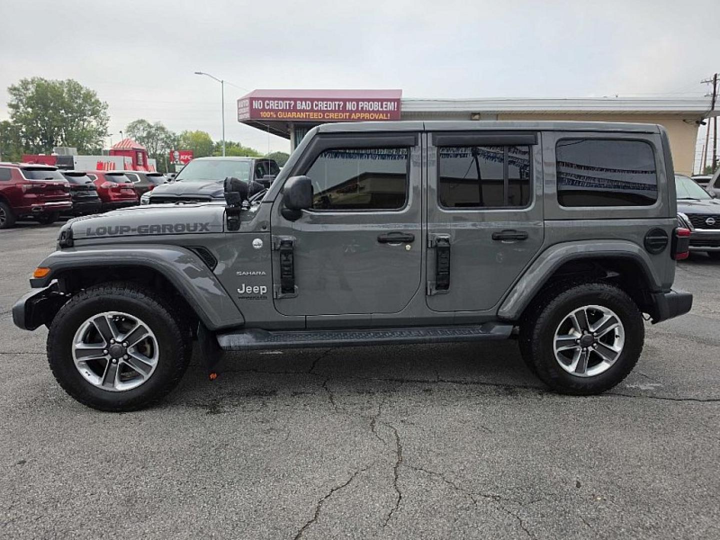 2019 GRAY /BLACK Jeep Wrangler Unlimited Sahara (1C4HJXEG2KW) with an 3.6L V6 DOHC 24V FFV engine, 6A transmission, located at 3304 Woodville Road, Northwood, OH, 43619, (419) 210-8019, 41.612694, -83.480743 - Your #1 Destination for Auto Loans and mdash;No Matter Your Credit!At our dealership, we believe everyone deserves the opportunity to drive their dream car and mdash;whether you have good credit, bad credit, or no credit at all. With a wide selection of hundreds of cars, trucks, and SUVs, you'll fin- Photo#1