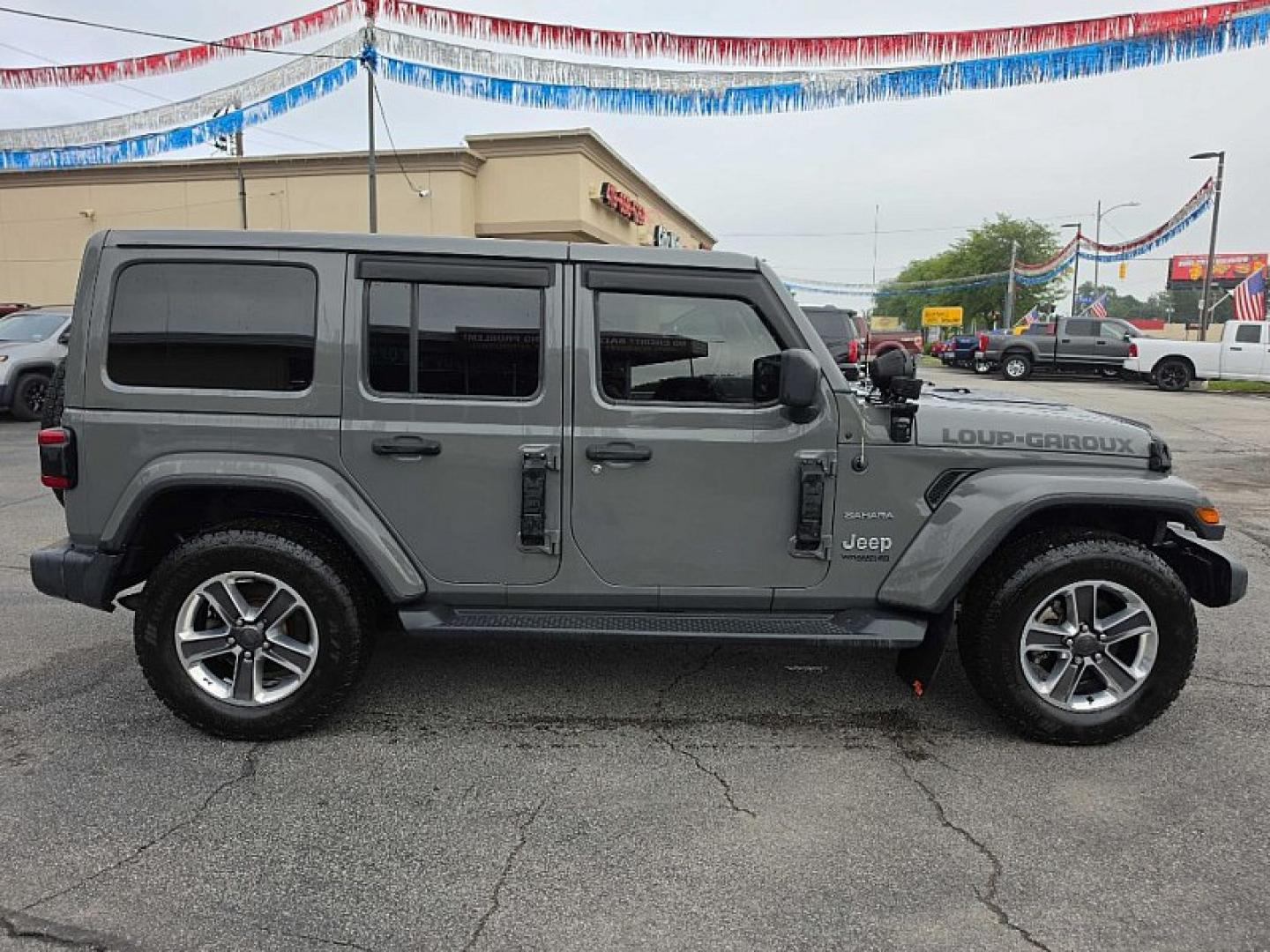 2019 GRAY /BLACK Jeep Wrangler Unlimited Sahara (1C4HJXEG2KW) with an 3.6L V6 DOHC 24V FFV engine, 6A transmission, located at 3304 Woodville Road, Northwood, OH, 43619, (419) 210-8019, 41.612694, -83.480743 - Your #1 Destination for Auto Loans and mdash;No Matter Your Credit!At our dealership, we believe everyone deserves the opportunity to drive their dream car and mdash;whether you have good credit, bad credit, or no credit at all. With a wide selection of hundreds of cars, trucks, and SUVs, you'll fin- Photo#5