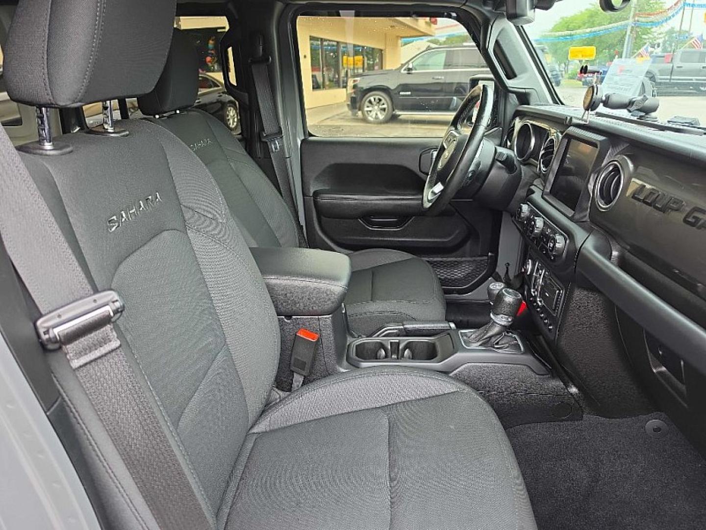 2019 GRAY /BLACK Jeep Wrangler Unlimited Sahara (1C4HJXEG2KW) with an 3.6L V6 DOHC 24V FFV engine, 6A transmission, located at 3304 Woodville Road, Northwood, OH, 43619, (419) 210-8019, 41.612694, -83.480743 - Your #1 Destination for Auto Loans and mdash;No Matter Your Credit!At our dealership, we believe everyone deserves the opportunity to drive their dream car and mdash;whether you have good credit, bad credit, or no credit at all. With a wide selection of hundreds of cars, trucks, and SUVs, you'll fin- Photo#16