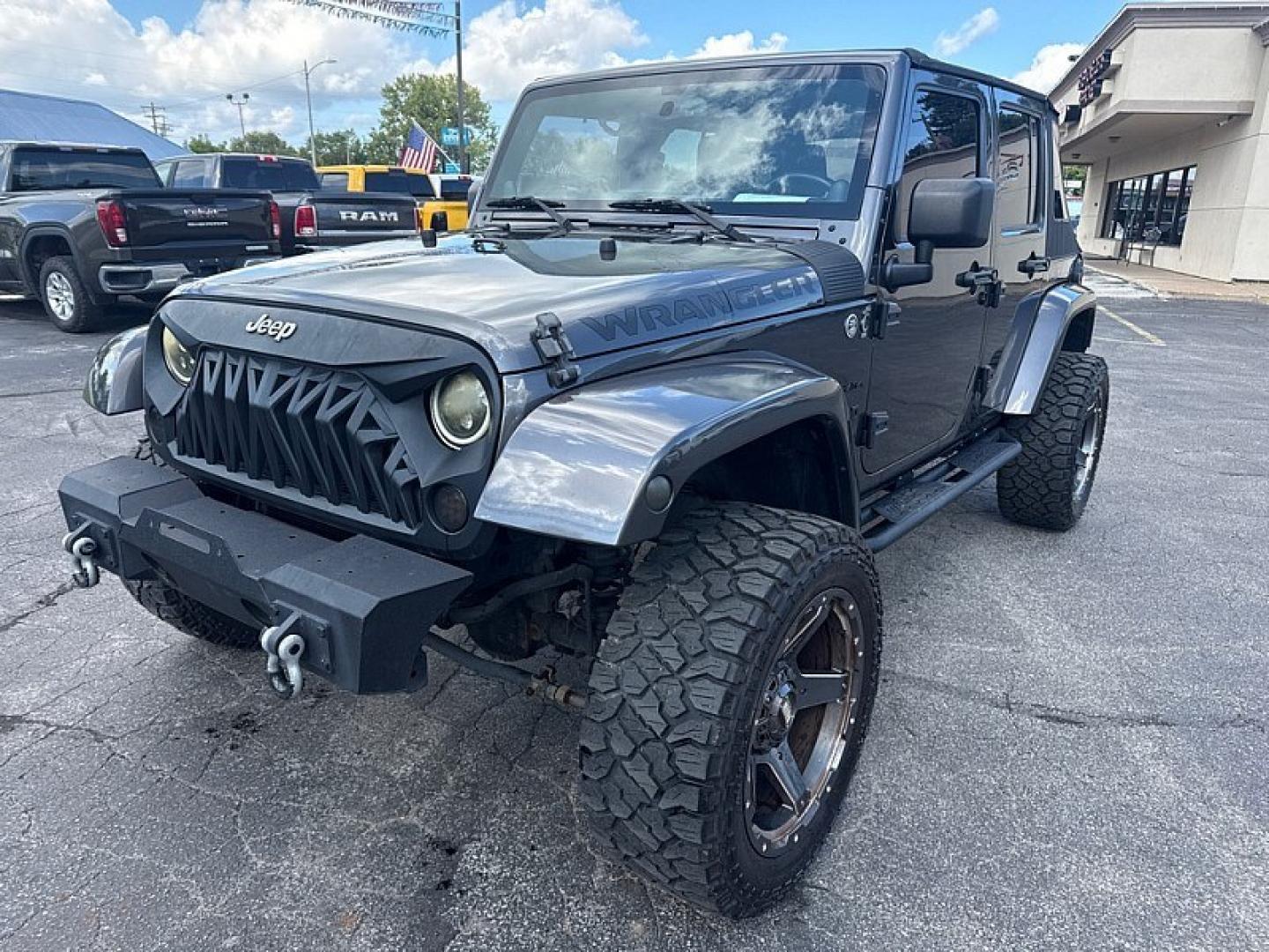 2014 GRAY /BLACK Jeep Wrangler Unlimited Sahara 4WD (1C4BJWEG5EL) with an 3.6L V6 DOHC 24V FFV engine, Automatic 5-Spd transmission, located at 3304 Woodville Road, Northwood, OH, 43619, (419) 210-8019, 41.612694, -83.480743 - Your #1 Destination for Auto Loans and mdash;No Matter Your Credit!At our dealership, we believe everyone deserves the opportunity to drive their dream car and mdash;whether you have good credit, bad credit, or no credit at all. With a wide selection of hundreds of cars, trucks, and SUVs, you'll fin- Photo#0