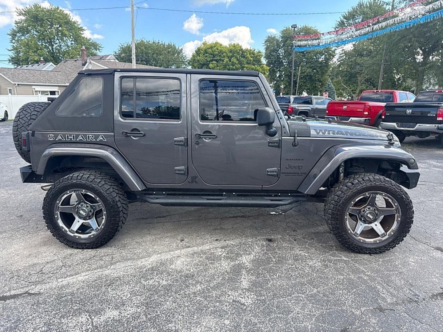 2014 GRAY /BLACK Jeep Wrangler Unlimited Sahara 4WD (1C4BJWEG5EL) with an 3.6L V6 DOHC 24V FFV engine, Automatic 5-Spd transmission, located at 3304 Woodville Road, Northwood, OH, 43619, (419) 210-8019, 41.612694, -83.480743 - Your #1 Destination for Auto Loans and mdash;No Matter Your Credit!At our dealership, we believe everyone deserves the opportunity to drive their dream car and mdash;whether you have good credit, bad credit, or no credit at all. With a wide selection of hundreds of cars, trucks, and SUVs, you'll fin- Photo#5