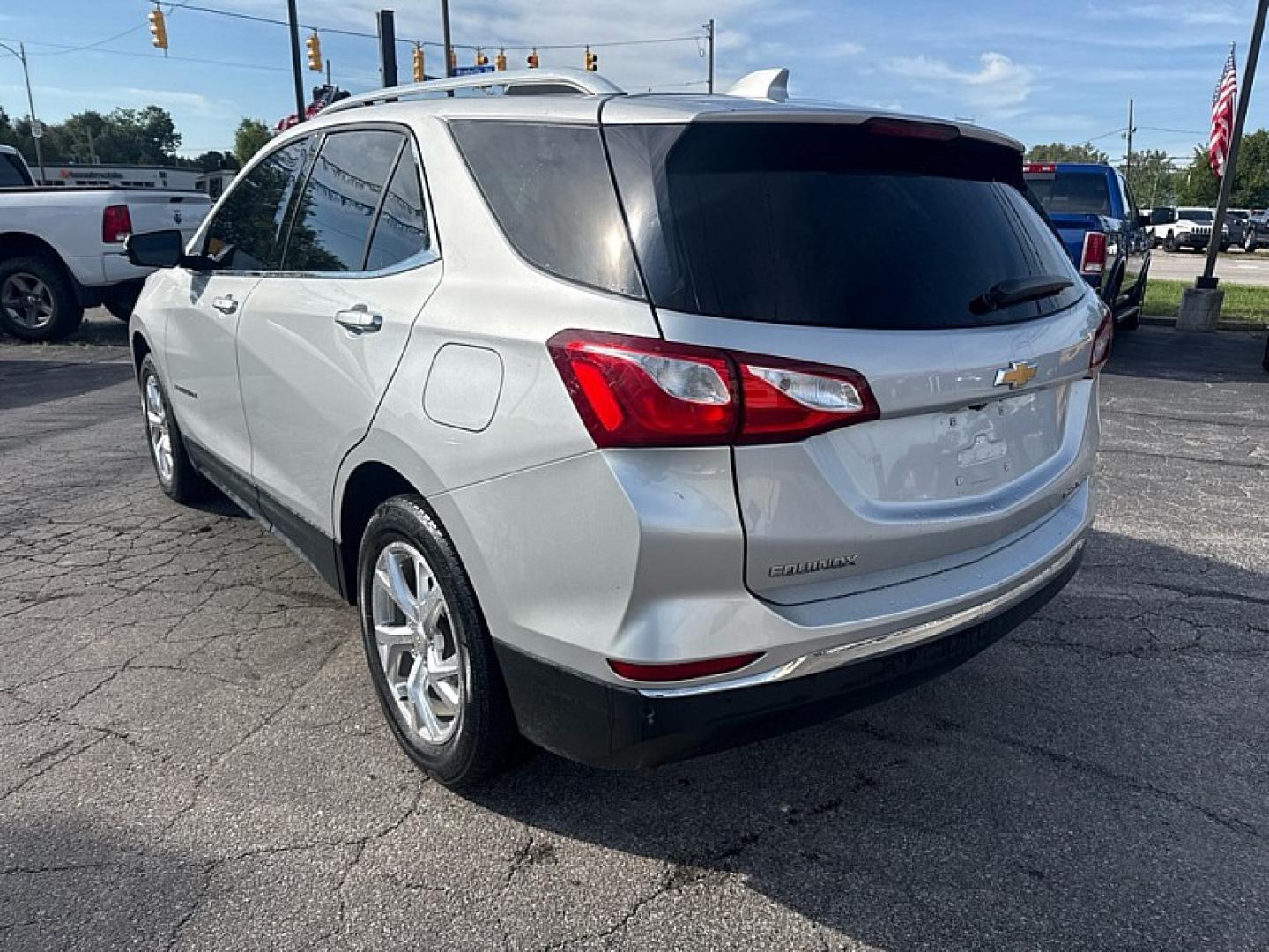 2020 SILVER /BLACK Chevrolet Equinox Premier 1.5 AWD (2GNAXXEV3L6) with an 1.5L L4 DOHC 16V TURBO engine, 6A transmission, located at 3304 Woodville Road, Northwood, OH, 43619, (419) 210-8019, 41.612694, -83.480743 - Your #1 Destination for Auto Loans and mdash;No Matter Your Credit!At our dealership, we believe everyone deserves the opportunity to drive their dream car and mdash;whether you have good credit, bad credit, or no credit at all. With a wide selection of hundreds of cars, trucks, and SUVs, you'll fin- Photo#2
