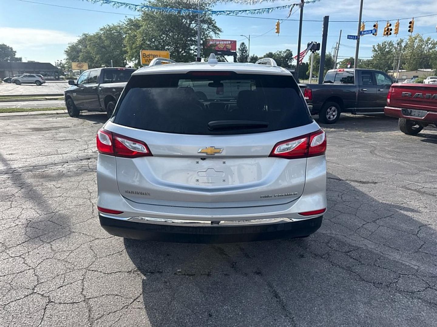 2020 SILVER /BLACK Chevrolet Equinox Premier 1.5 AWD (2GNAXXEV3L6) with an 1.5L L4 DOHC 16V TURBO engine, 6A transmission, located at 3304 Woodville Road, Northwood, OH, 43619, (419) 210-8019, 41.612694, -83.480743 - Your #1 Destination for Auto Loans and mdash;No Matter Your Credit!At our dealership, we believe everyone deserves the opportunity to drive their dream car and mdash;whether you have good credit, bad credit, or no credit at all. With a wide selection of hundreds of cars, trucks, and SUVs, you'll fin- Photo#3