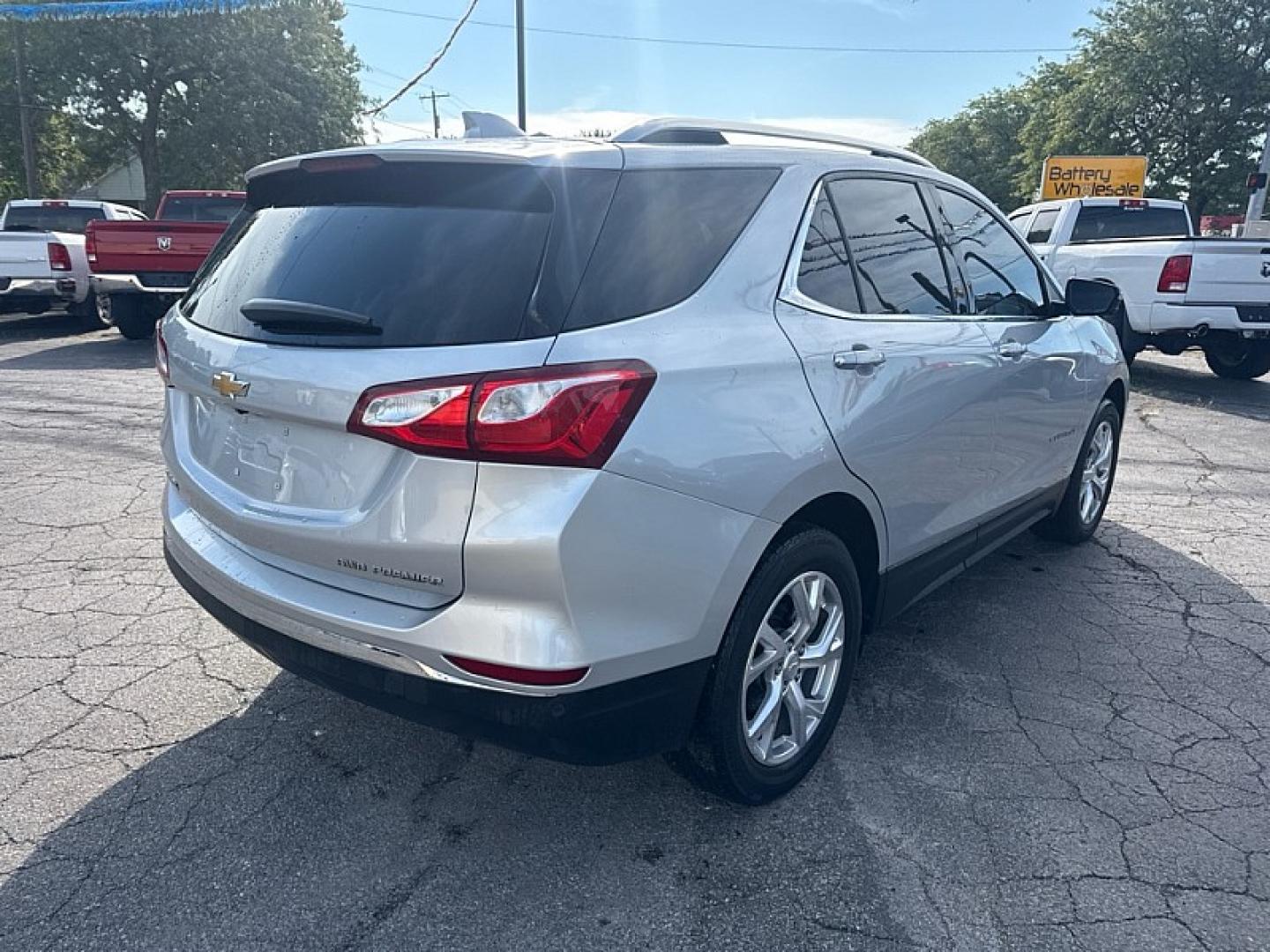 2020 SILVER /BLACK Chevrolet Equinox Premier 1.5 AWD (2GNAXXEV3L6) with an 1.5L L4 DOHC 16V TURBO engine, 6A transmission, located at 3304 Woodville Road, Northwood, OH, 43619, (419) 210-8019, 41.612694, -83.480743 - Your #1 Destination for Auto Loans and mdash;No Matter Your Credit!At our dealership, we believe everyone deserves the opportunity to drive their dream car and mdash;whether you have good credit, bad credit, or no credit at all. With a wide selection of hundreds of cars, trucks, and SUVs, you'll fin- Photo#4