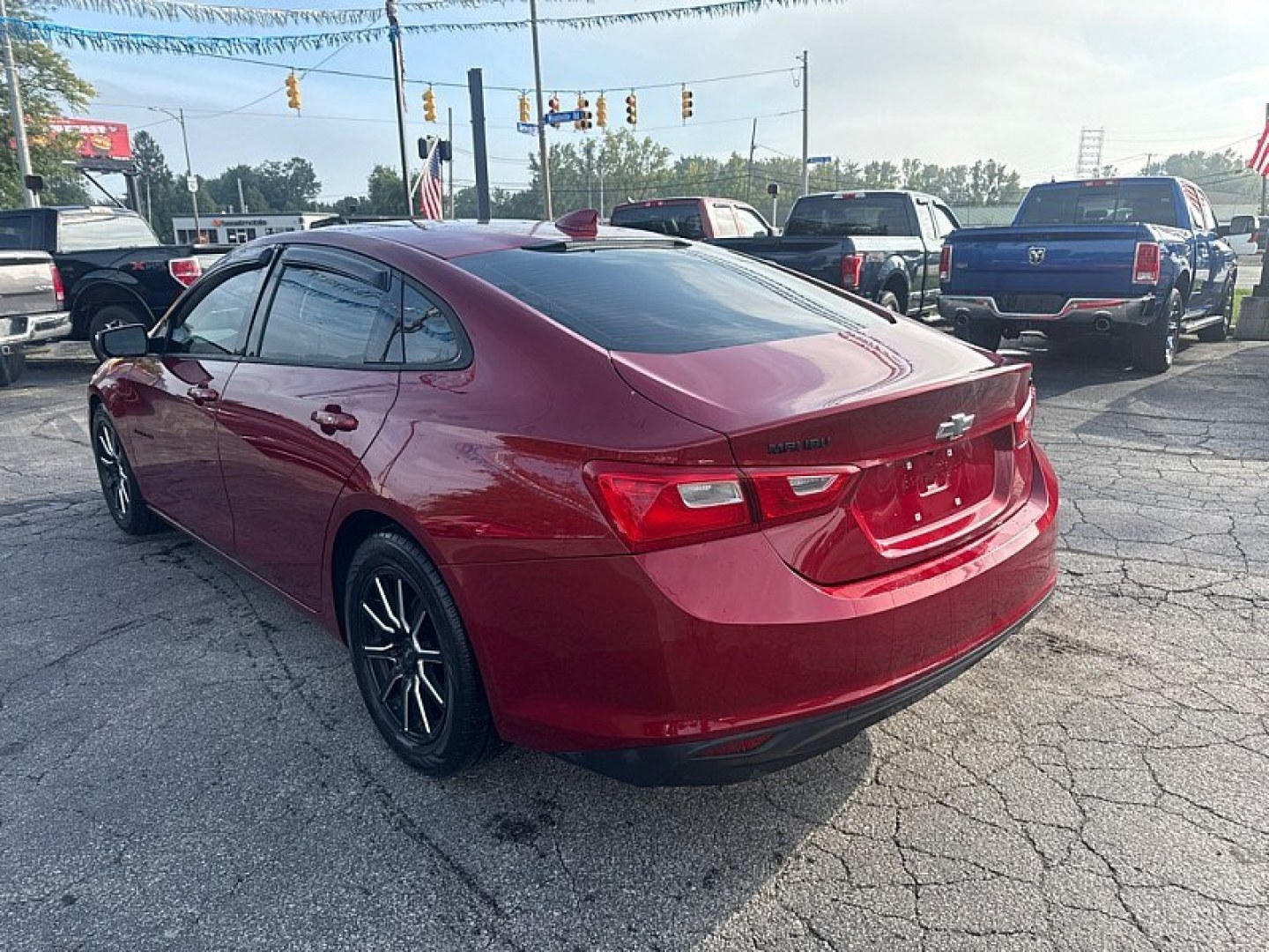 2017 RED /BLACK Chevrolet Malibu 1LT (1G1ZE5ST1HF) with an 1.5L L4 DOHC 16V engine, 6A transmission, located at 3304 Woodville Road, Northwood, OH, 43619, (419) 210-8019, 41.612694, -83.480743 - Your #1 Destination for Auto Loans and mdash;No Matter Your Credit!At our dealership, we believe everyone deserves the opportunity to drive their dream car and mdash;whether you have good credit, bad credit, or no credit at all. With a wide selection of hundreds of cars, trucks, and SUVs, you'll fin- Photo#2