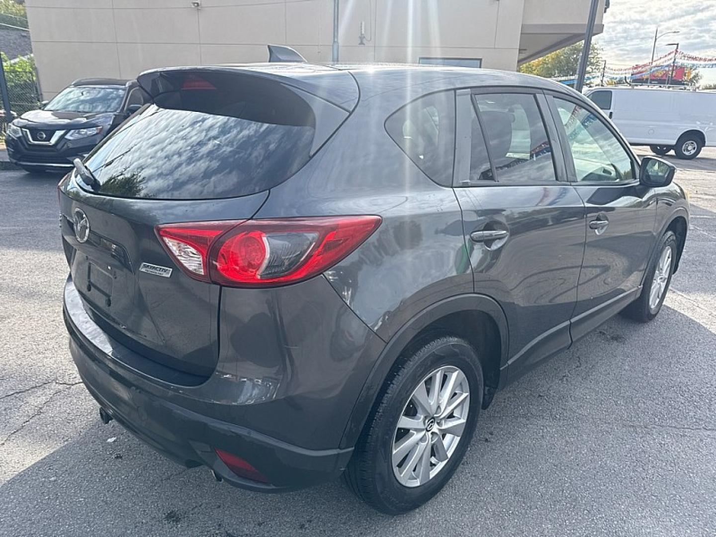 2015 BLACK /BLACK Mazda CX-5 Sport AWD (JM3KE4BE1F0) with an 2.5L L4 DOHC 16V engine, 6A transmission, located at 3304 Woodville Road, Northwood, OH, 43619, (419) 210-8019, 41.612694, -83.480743 - Your #1 Destination for Auto Loans and mdash;No Matter Your Credit!At our dealership, we believe everyone deserves the opportunity to drive their dream car and mdash;whether you have good credit, bad credit, or no credit at all. With a wide selection of hundreds of cars, trucks, and SUVs, you'll fin- Photo#4