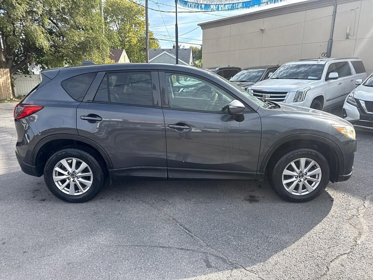 2015 BLACK /BLACK Mazda CX-5 Sport AWD (JM3KE4BE1F0) with an 2.5L L4 DOHC 16V engine, 6A transmission, located at 3304 Woodville Road, Northwood, OH, 43619, (419) 210-8019, 41.612694, -83.480743 - Your #1 Destination for Auto Loans and mdash;No Matter Your Credit!At our dealership, we believe everyone deserves the opportunity to drive their dream car and mdash;whether you have good credit, bad credit, or no credit at all. With a wide selection of hundreds of cars, trucks, and SUVs, you'll fin- Photo#5