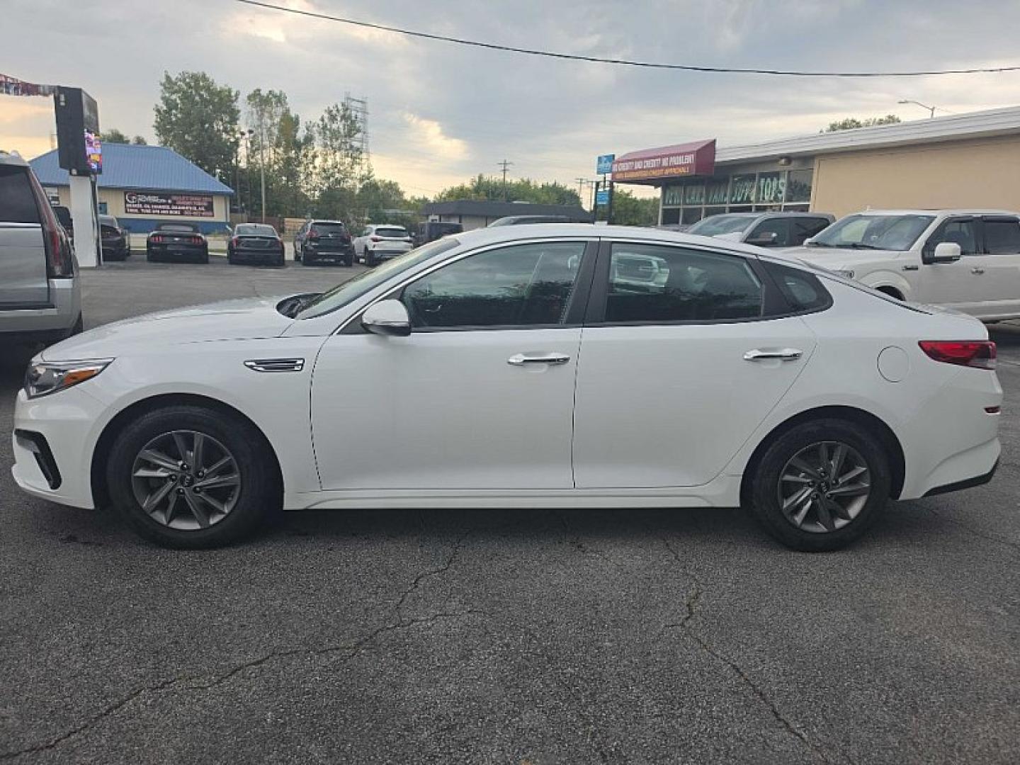2020 WHITE /BLACK Kia Optima LX (5XXGT4L35LG) with an 2.4L L4 DOHC 16V engine, 6A transmission, located at 3304 Woodville Road, Northwood, OH, 43619, (419) 210-8019, 41.612694, -83.480743 - Your #1 Destination for Auto Loans and mdash;No Matter Your Credit!At our dealership, we believe everyone deserves the opportunity to drive their dream car and mdash;whether you have good credit, bad credit, or no credit at all. With a wide selection of hundreds of cars, trucks, and SUVs, you'll fin- Photo#1