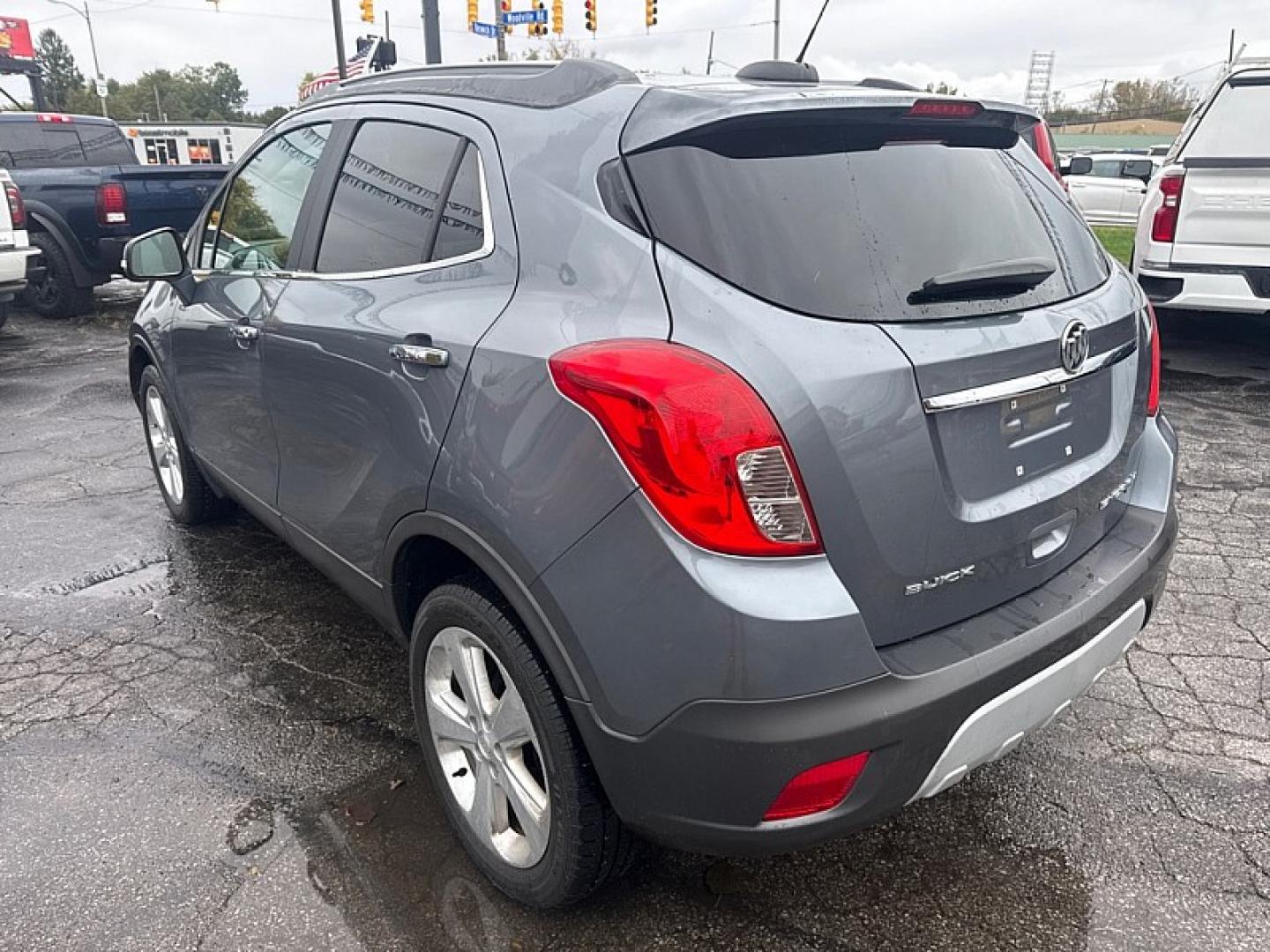 2015 GRAY /BLACK Buick Encore Convenience AWD (KL4CJFSB1FB) with an 1.4L L4 DOHC 16V TURBO engine, 6A transmission, located at 3304 Woodville Road, Northwood, OH, 43619, (419) 210-8019, 41.612694, -83.480743- Photo#2