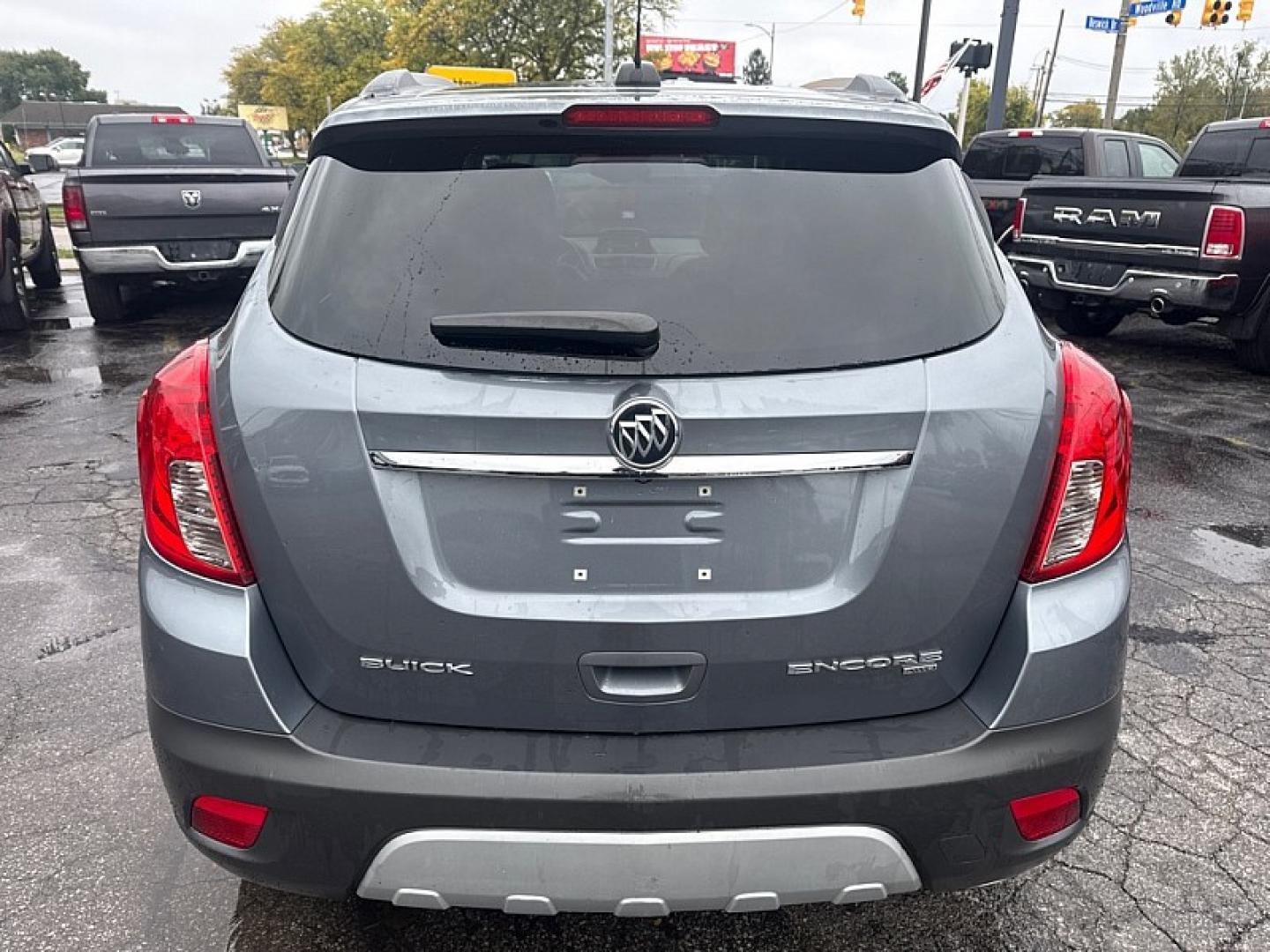 2015 GRAY /BLACK Buick Encore Convenience AWD (KL4CJFSB1FB) with an 1.4L L4 DOHC 16V TURBO engine, 6A transmission, located at 3304 Woodville Road, Northwood, OH, 43619, (419) 210-8019, 41.612694, -83.480743- Photo#3