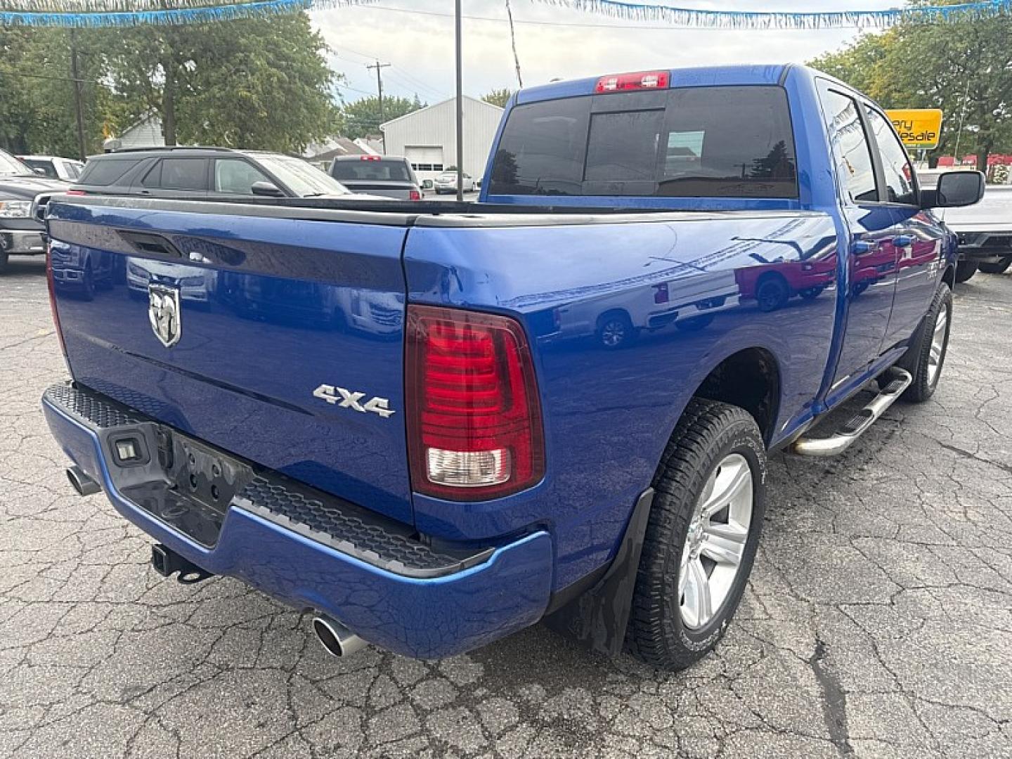 2015 BLUE /BLACK Ram 1500 Sport Quad Cab 4WD (1C6RR7HT4FS) with an 5.7L V8 OHV 16V engine, 6A transmission, located at 3304 Woodville Road, Northwood, OH, 43619, (419) 210-8019, 41.612694, -83.480743 - Your #1 Destination for Auto Loans and mdash;No Matter Your Credit!At our dealership, we believe everyone deserves the opportunity to drive their dream car and mdash;whether you have good credit, bad credit, or no credit at all. With a wide selection of hundreds of cars, trucks, and SUVs, you'll fin- Photo#4
