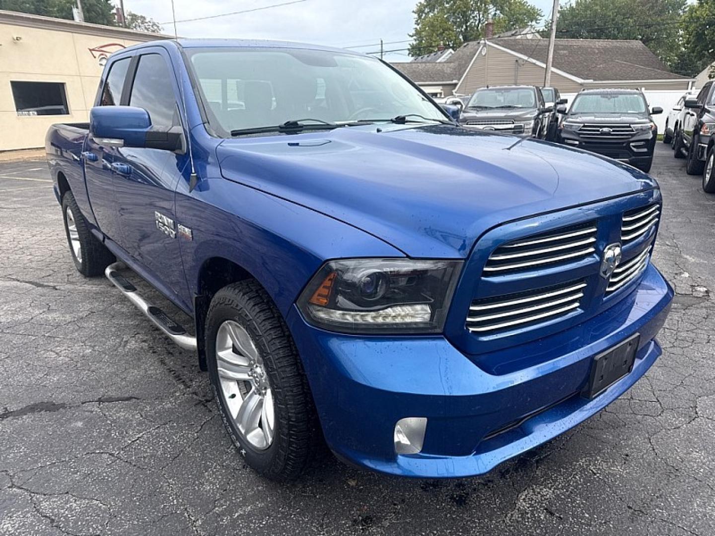 2015 BLUE /BLACK Ram 1500 Sport Quad Cab 4WD (1C6RR7HT4FS) with an 5.7L V8 OHV 16V engine, 6A transmission, located at 3304 Woodville Road, Northwood, OH, 43619, (419) 210-8019, 41.612694, -83.480743 - Your #1 Destination for Auto Loans and mdash;No Matter Your Credit!At our dealership, we believe everyone deserves the opportunity to drive their dream car and mdash;whether you have good credit, bad credit, or no credit at all. With a wide selection of hundreds of cars, trucks, and SUVs, you'll fin- Photo#6