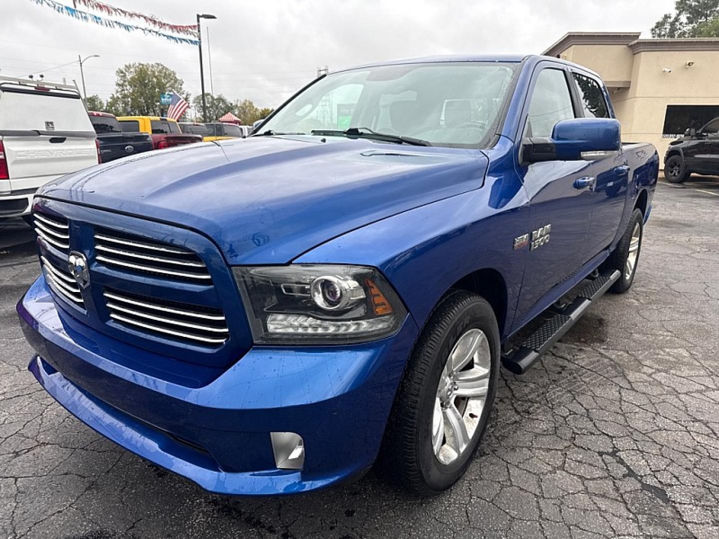 2014 BLUE /BLACK Ram 1500 Sport Crew Cab SWB 4WD (1C6RR7MTXES) with an 5.7L V8 OHV 16V engine, 6-Speed Automatic transmission, located at 3304 Woodville Road, Northwood, OH, 43619, (419) 210-8019, 41.612694, -83.480743 - Your #1 Destination for Auto Loans and mdash;No Matter Your Credit!At our dealership, we believe everyone deserves the opportunity to drive their dream car and mdash;whether you have good credit, bad credit, or no credit at all. With a wide selection of hundreds of cars, trucks, and SUVs, you'll fin- Photo#0