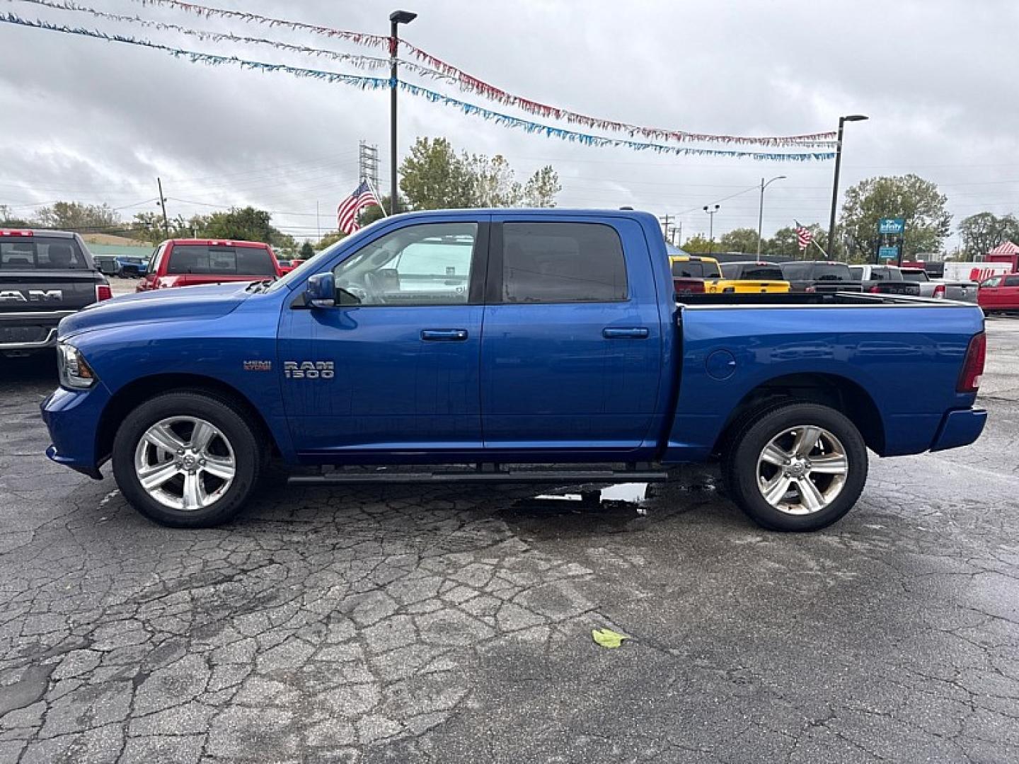 2014 BLUE /BLACK Ram 1500 Sport Crew Cab SWB 4WD (1C6RR7MTXES) with an 5.7L V8 OHV 16V engine, 6-Speed Automatic transmission, located at 3304 Woodville Road, Northwood, OH, 43619, (419) 210-8019, 41.612694, -83.480743 - Your #1 Destination for Auto Loans and mdash;No Matter Your Credit!At our dealership, we believe everyone deserves the opportunity to drive their dream car and mdash;whether you have good credit, bad credit, or no credit at all. With a wide selection of hundreds of cars, trucks, and SUVs, you'll fin- Photo#1