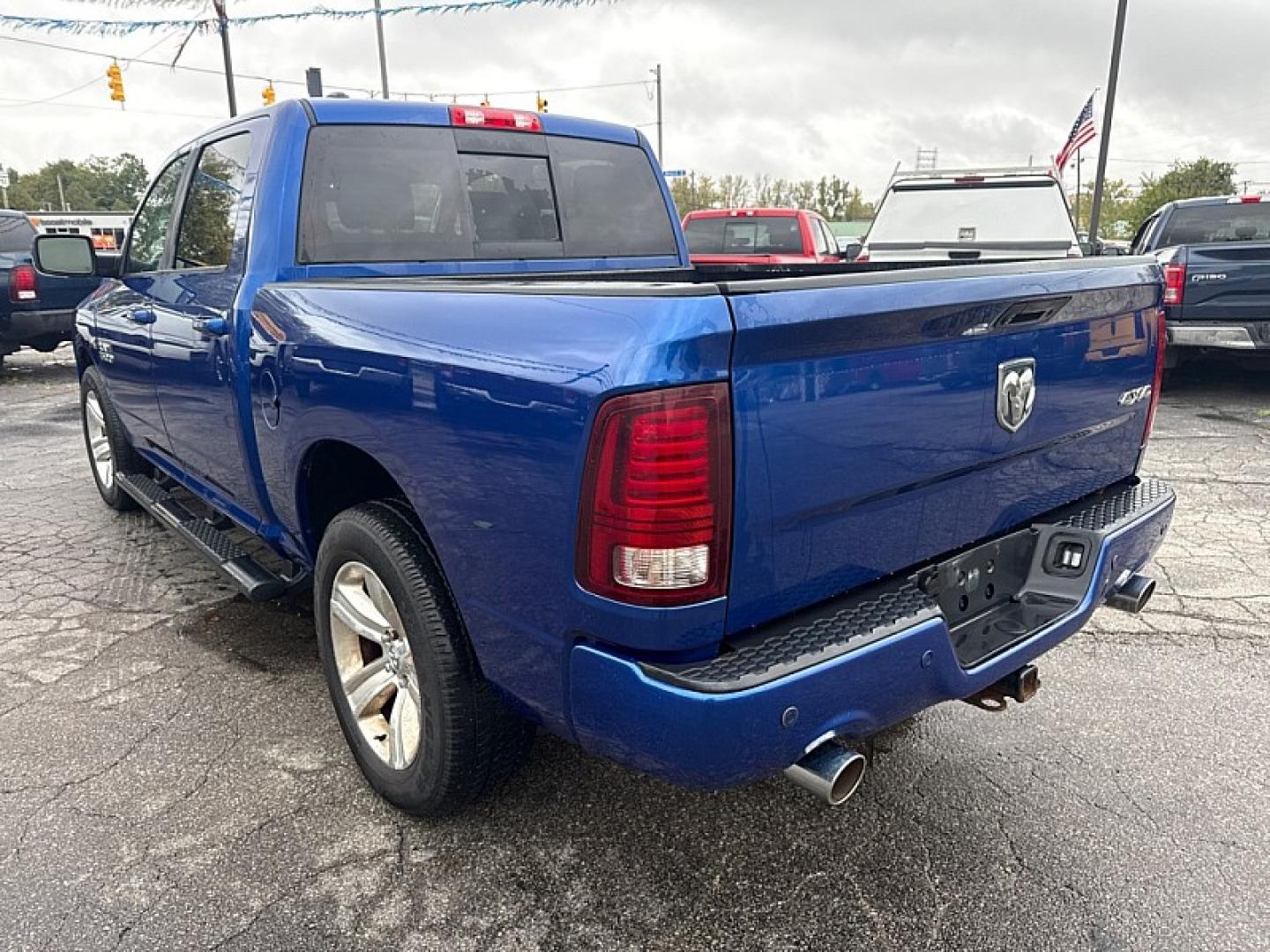 2014 BLUE /BLACK Ram 1500 Sport Crew Cab SWB 4WD (1C6RR7MTXES) with an 5.7L V8 OHV 16V engine, 6-Speed Automatic transmission, located at 3304 Woodville Road, Northwood, OH, 43619, (419) 210-8019, 41.612694, -83.480743 - Your #1 Destination for Auto Loans and mdash;No Matter Your Credit!At our dealership, we believe everyone deserves the opportunity to drive their dream car and mdash;whether you have good credit, bad credit, or no credit at all. With a wide selection of hundreds of cars, trucks, and SUVs, you'll fin- Photo#2