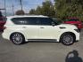 2016 WHITE /BLACK Infiniti QX80 4WD (JN8AZ2NC7G9) with an 5.6L V8 DOHC 32V engine, 7A transmission, located at 3304 Woodville Road, Northwood, OH, 43619, (419) 210-8019, 41.612694, -83.480743 - Your #1 Destination for Auto Loans and mdash;No Matter Your Credit!At our dealership, we believe everyone deserves the opportunity to drive their dream car and mdash;whether you have good credit, bad credit, or no credit at all. With a wide selection of hundreds of cars, trucks, and SUVs, you'll fin- Photo#5