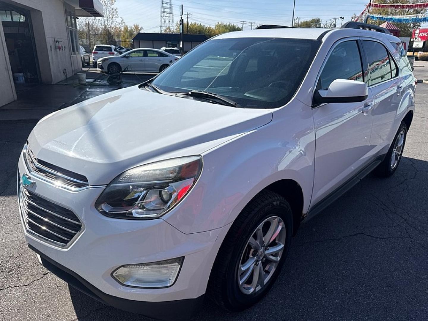 2016 WHITE /BLACK Chevrolet Equinox LT AWD (2GNFLFEK3G6) with an 2.4L L4 DOHC 16V FFV engine, 6A transmission, located at 3304 Woodville Road, Northwood, OH, 43619, (419) 210-8019, 41.612694, -83.480743 - Your #1 Destination for Auto Loans and mdash;No Matter Your Credit!At our dealership, we believe everyone deserves the opportunity to drive their dream car and mdash;whether you have good credit, bad credit, or no credit at all. With a wide selection of hundreds of cars, trucks, and SUVs, you'll fin- Photo#2