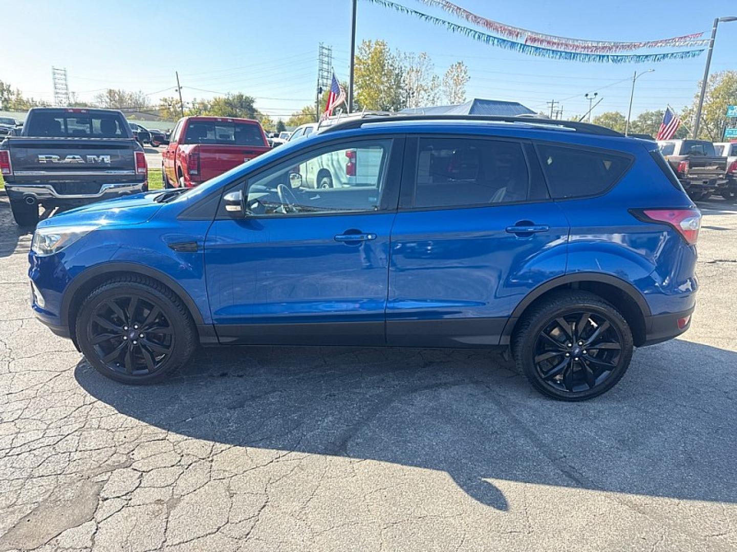 2017 BLUE /BLACK Ford Escape Titanium 4WD (1FMCU9J95HU) with an 2.0L L4 DOHC 16V engine, 6A transmission, located at 3304 Woodville Road, Northwood, OH, 43619, (419) 210-8019, 41.612694, -83.480743 - Your #1 Destination for Auto Loans and mdash;No Matter Your Credit!At our dealership, we believe everyone deserves the opportunity to drive their dream car and mdash;whether you have good credit, bad credit, or no credit at all. With a wide selection of hundreds of cars, trucks, and SUVs, you'll fin- Photo#1