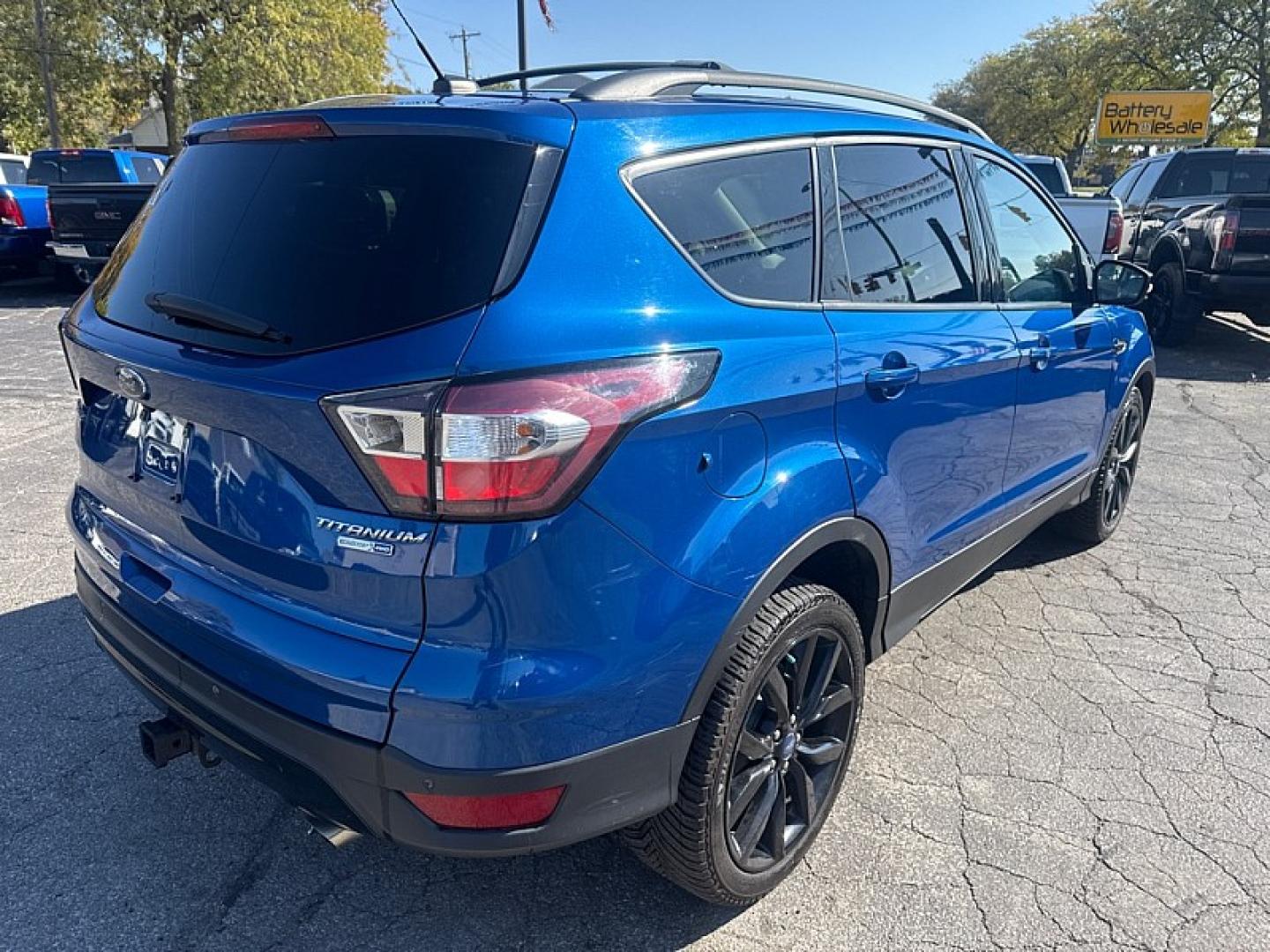 2017 BLUE /BLACK Ford Escape Titanium 4WD (1FMCU9J95HU) with an 2.0L L4 DOHC 16V engine, 6A transmission, located at 3304 Woodville Road, Northwood, OH, 43619, (419) 210-8019, 41.612694, -83.480743 - Your #1 Destination for Auto Loans and mdash;No Matter Your Credit!At our dealership, we believe everyone deserves the opportunity to drive their dream car and mdash;whether you have good credit, bad credit, or no credit at all. With a wide selection of hundreds of cars, trucks, and SUVs, you'll fin- Photo#4